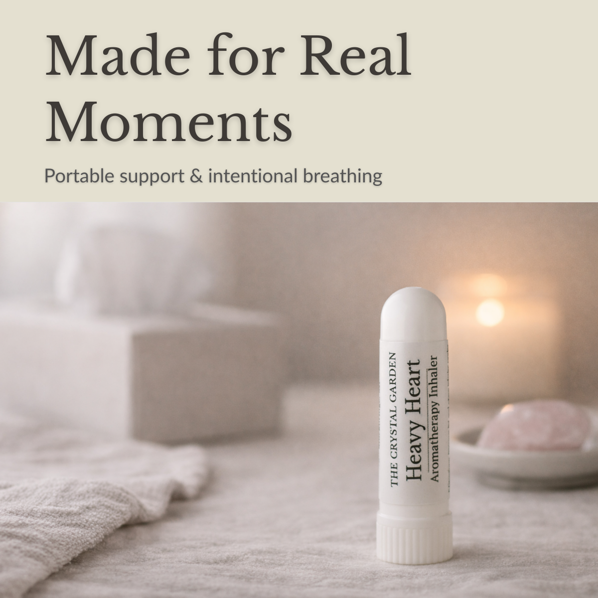 Heavy Heart aromatherapy inhaler standing on a neutral surface with soft linen, candlelight, and rose quartz in a calm reflective setting.