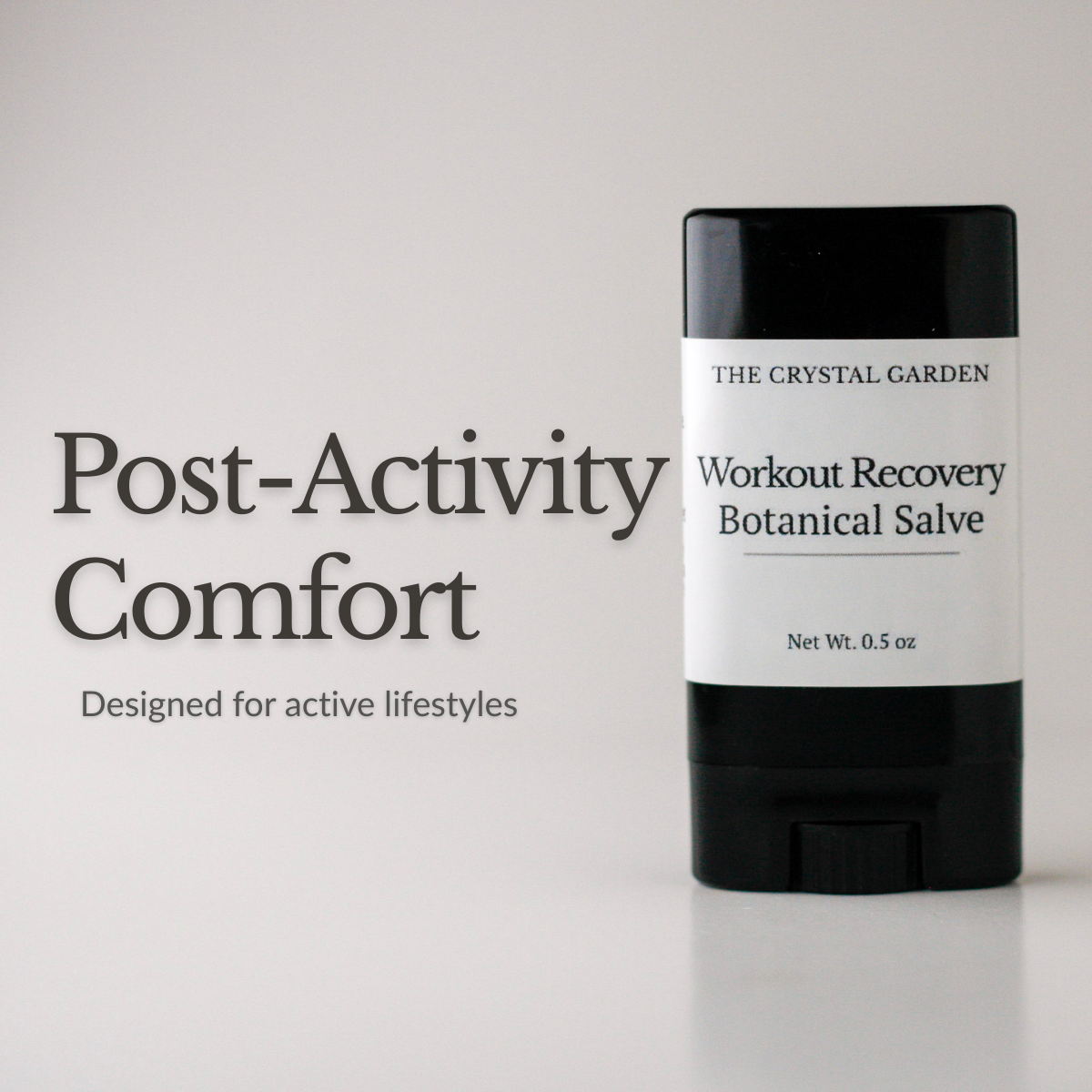Workout Recovery Botanical Salve in a black 0.5 oz twist-up tube with minimal label on a soft neutral background