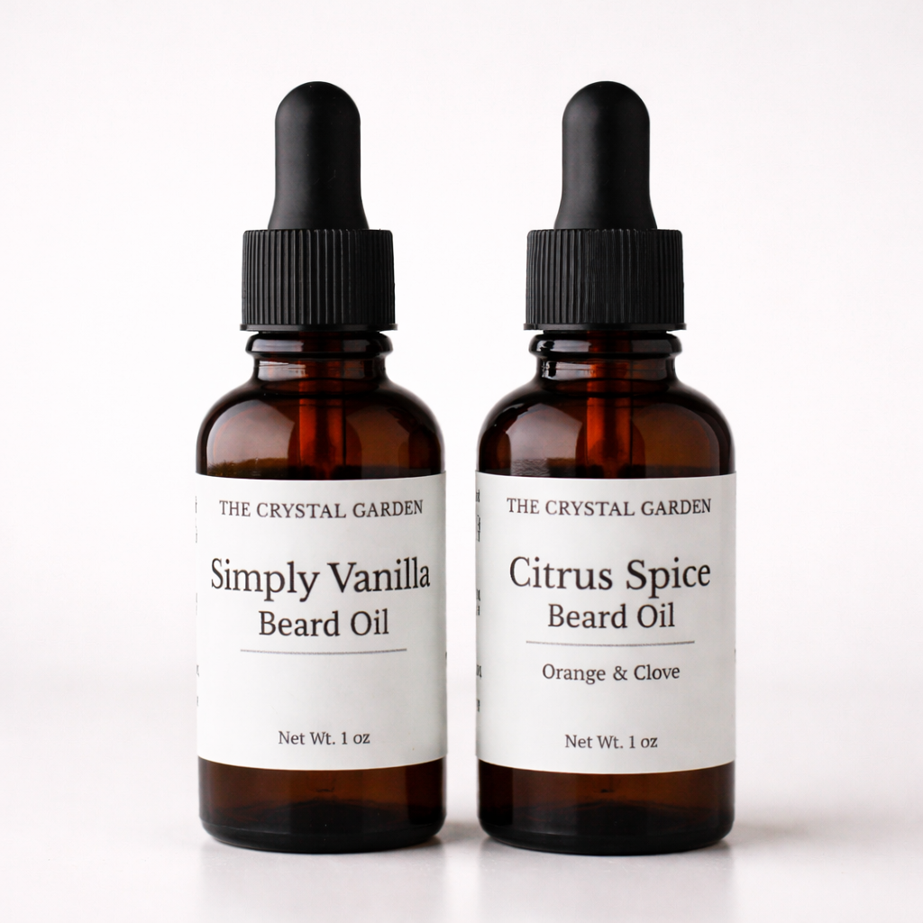 Plant-based beard oils in amber glass dropper bottles in Simply Vanilla and Citrus Spice scents by The Crystal Garden.