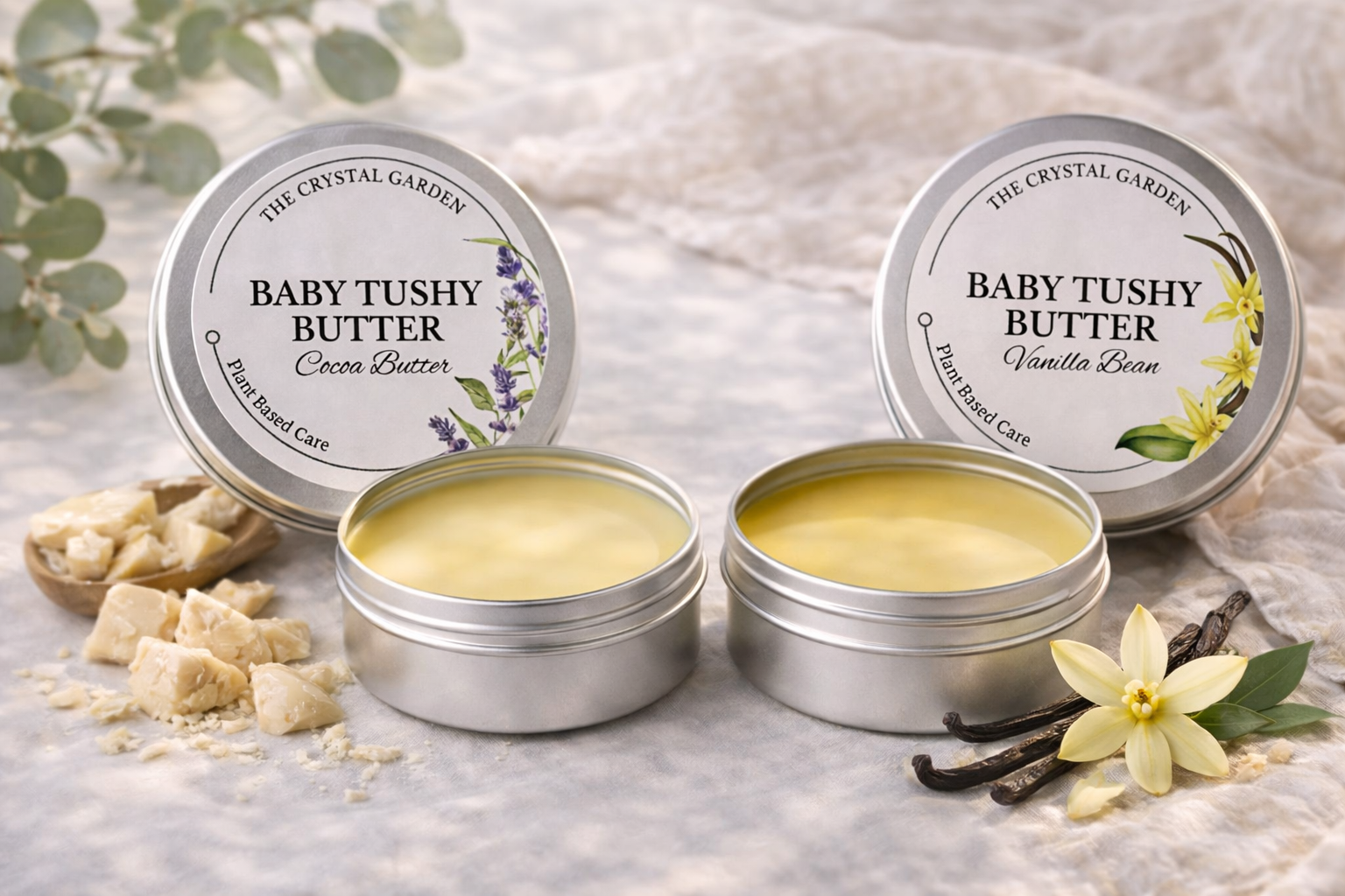 Baby Tushy Butter cocoa butter and vanilla bean plant-based baby balm in metal tins with natural ingredients on soft neutral background