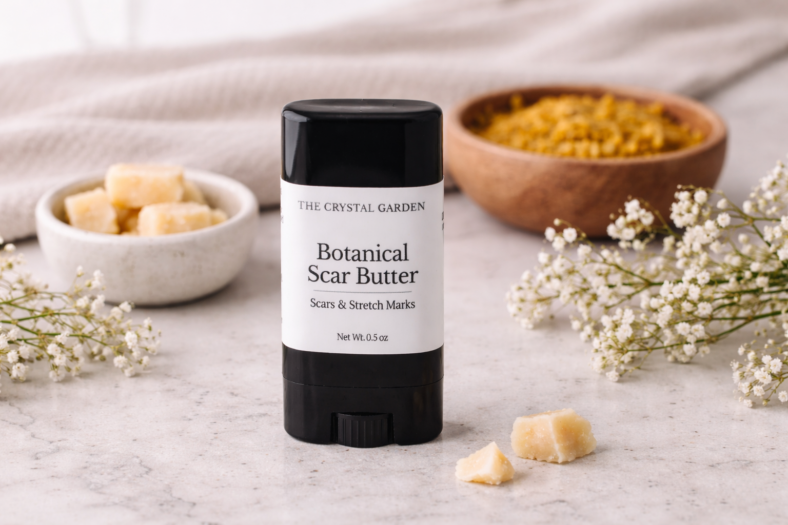 Botanical Scar Butter for scars and stretch marks on marble countertop with towel and botanical butters for daily massage skincare routine.