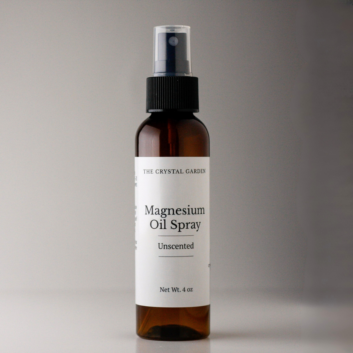 Magnesium oil spray in amber bottle with black spray top by The Crystal Garden, 4oz bottle