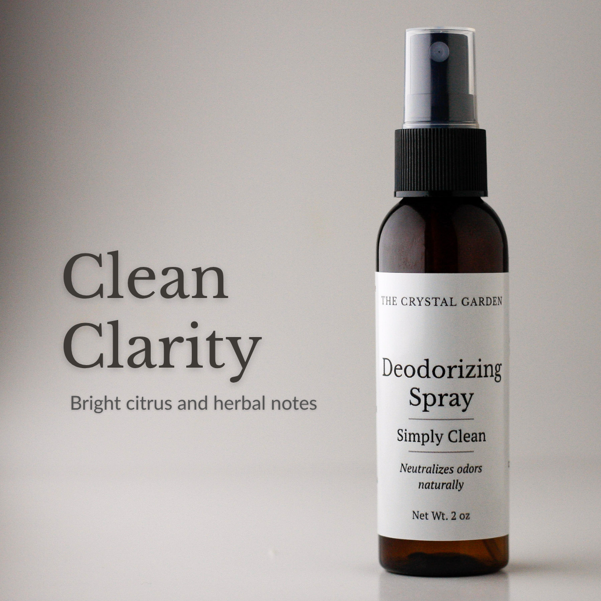 The Crystal Garden Simply Clean deodorizing spray in a 2 oz amber bottle on a white background.