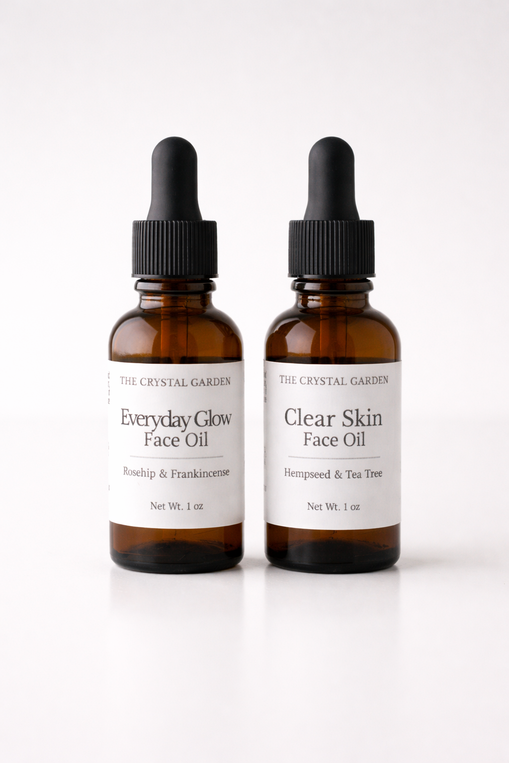 Everyday Glow and Clear Skin face oils in amber glass dropper bottles by The Crystal Garden.