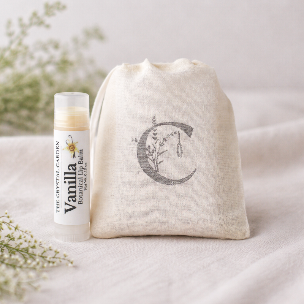 vanilla lip balm tube next to a 3x5 muslin bag stamped with The Crystal Garden complany logo