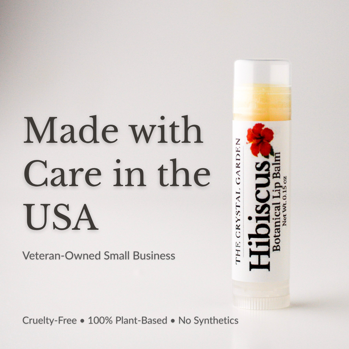SEO Alt text (optional longer version): Hibiscus Botanical natural lip balm in white tube with botanical label on a white to light gray background, plant-based lip care by The Crystal Garden.
