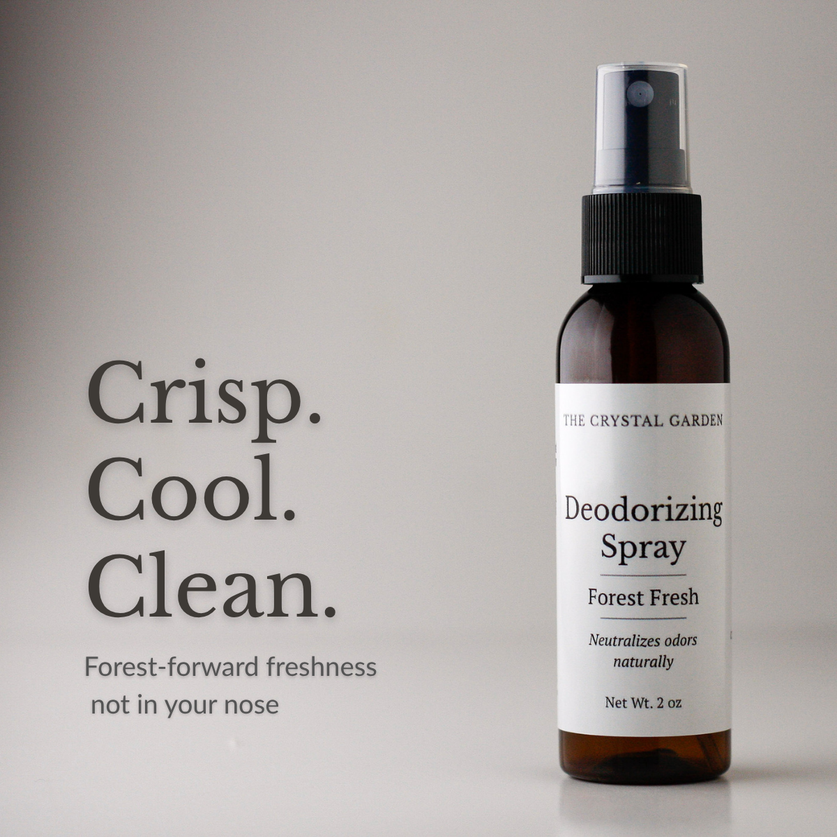 The Crystal Garden Forest Fresh deodorizing spray in a 2 oz amber bottle on a white background.
