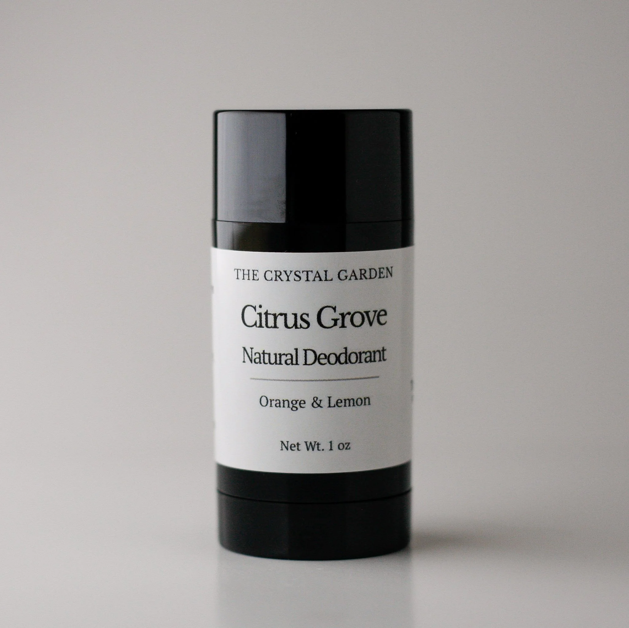 Citrus Grove Natural Deodorant plant-based deodorant with orange, lemon, and lime essential oils in black twist-up tube