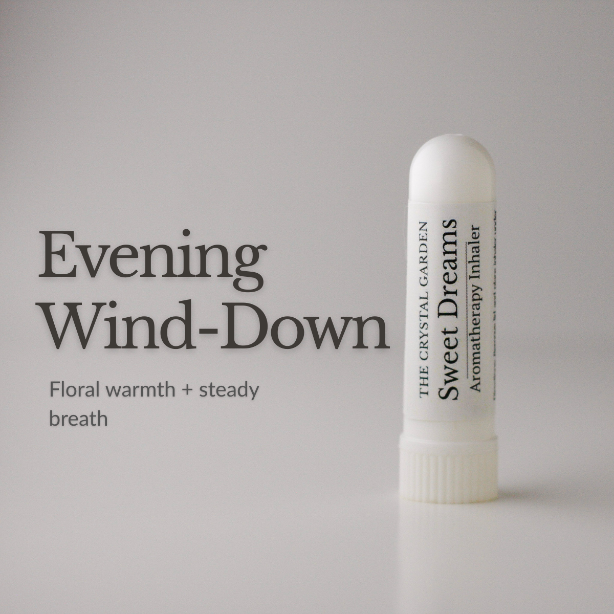 Sweet Dreams aromatherapy inhaler by The Crystal Garden resting on a soft neutral surface in a calming nighttime setting.
