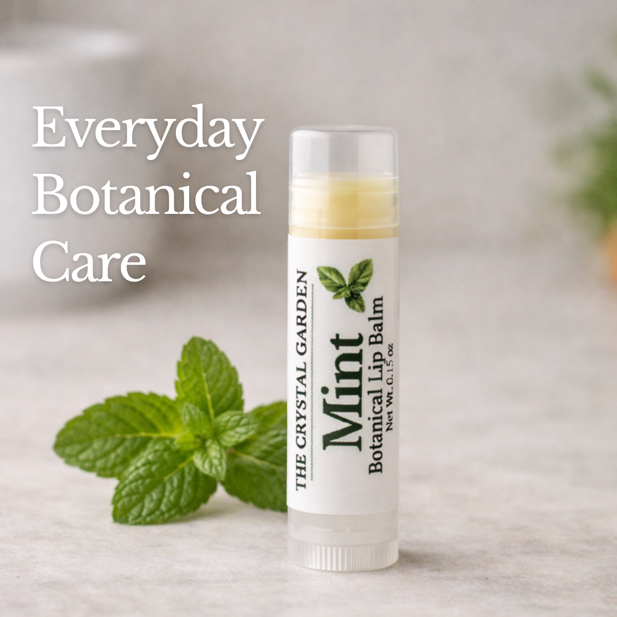 Mint Botanical Lip Balm with mint leaves on countertop for plant-based lip care