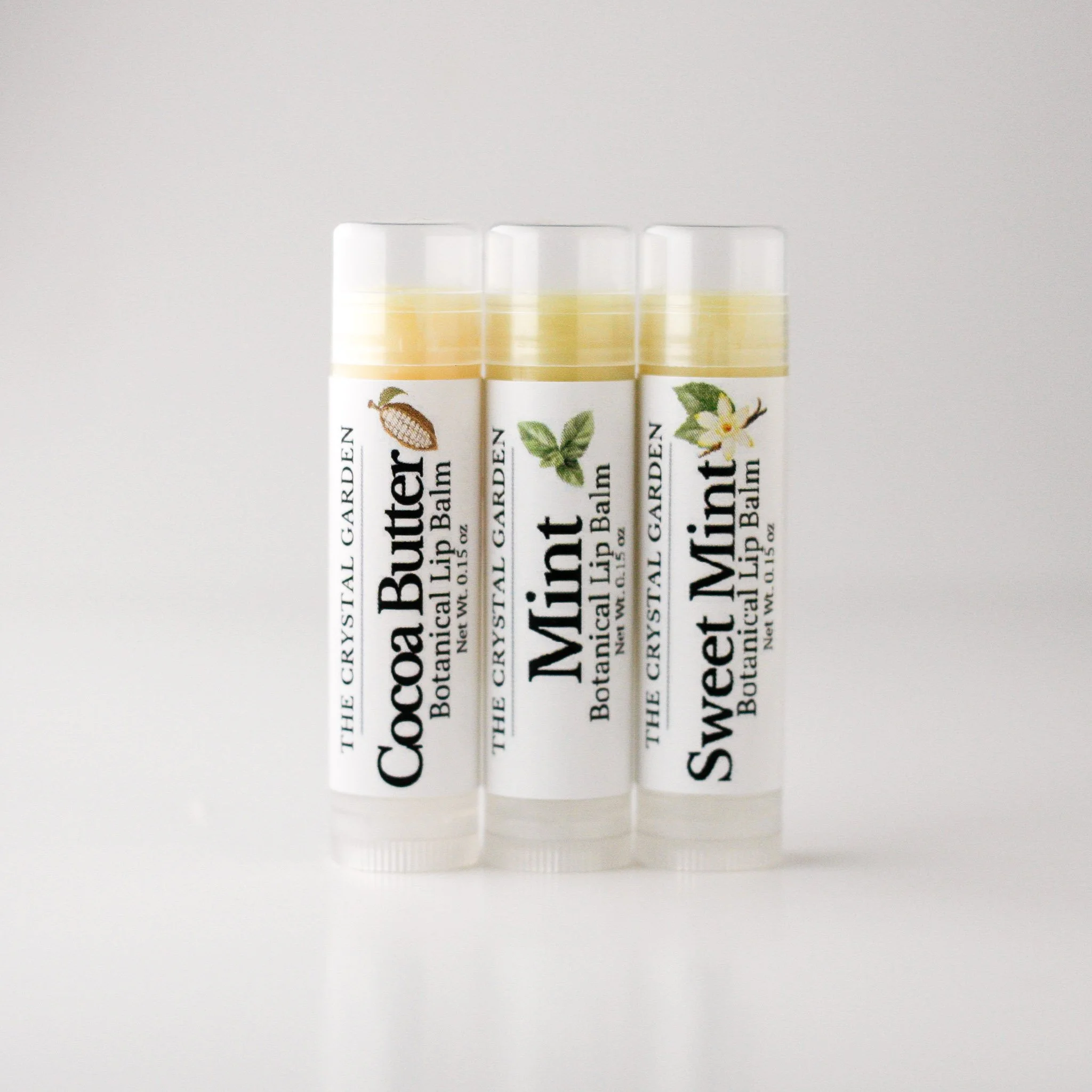 Three lip bam on nutrual-gray back drop