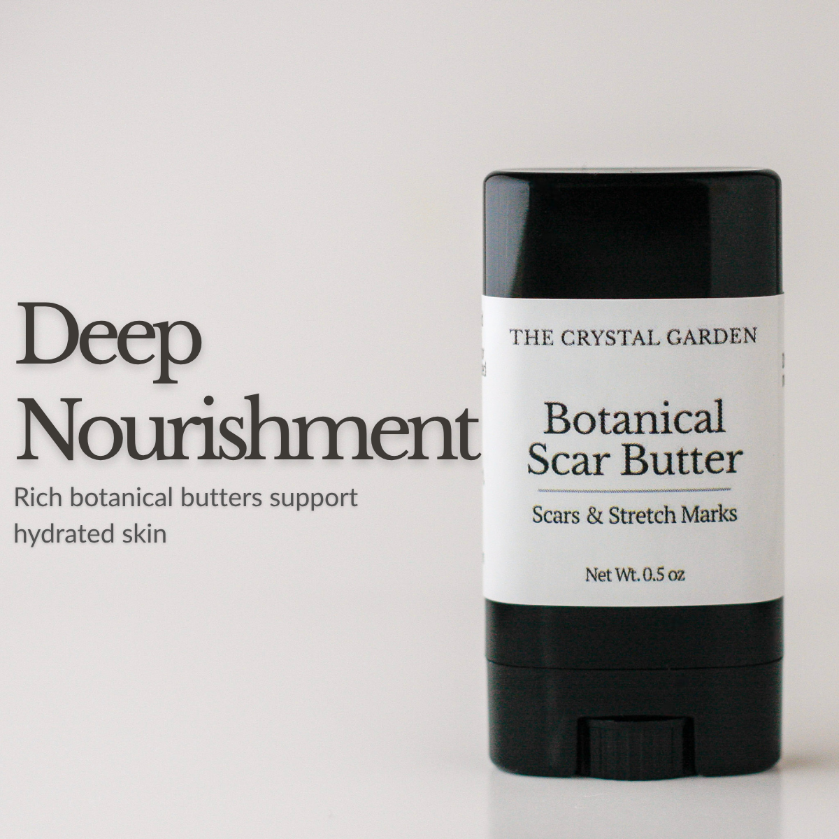 Botanical Scar Butter scars and stretch mark butter in black twist-up tube on white background.