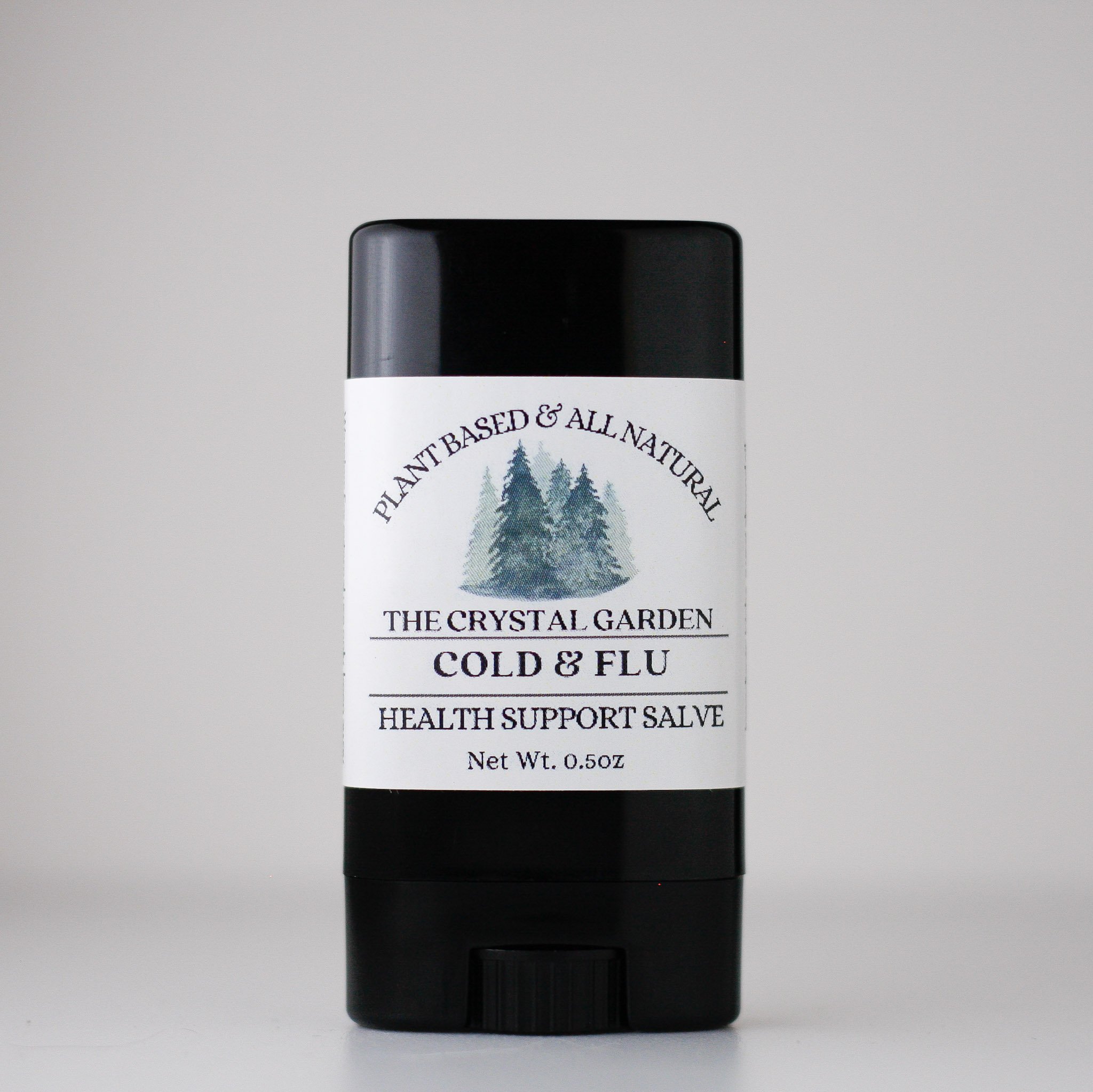 black tube labeld cold and flu with pine trees on nutrual background