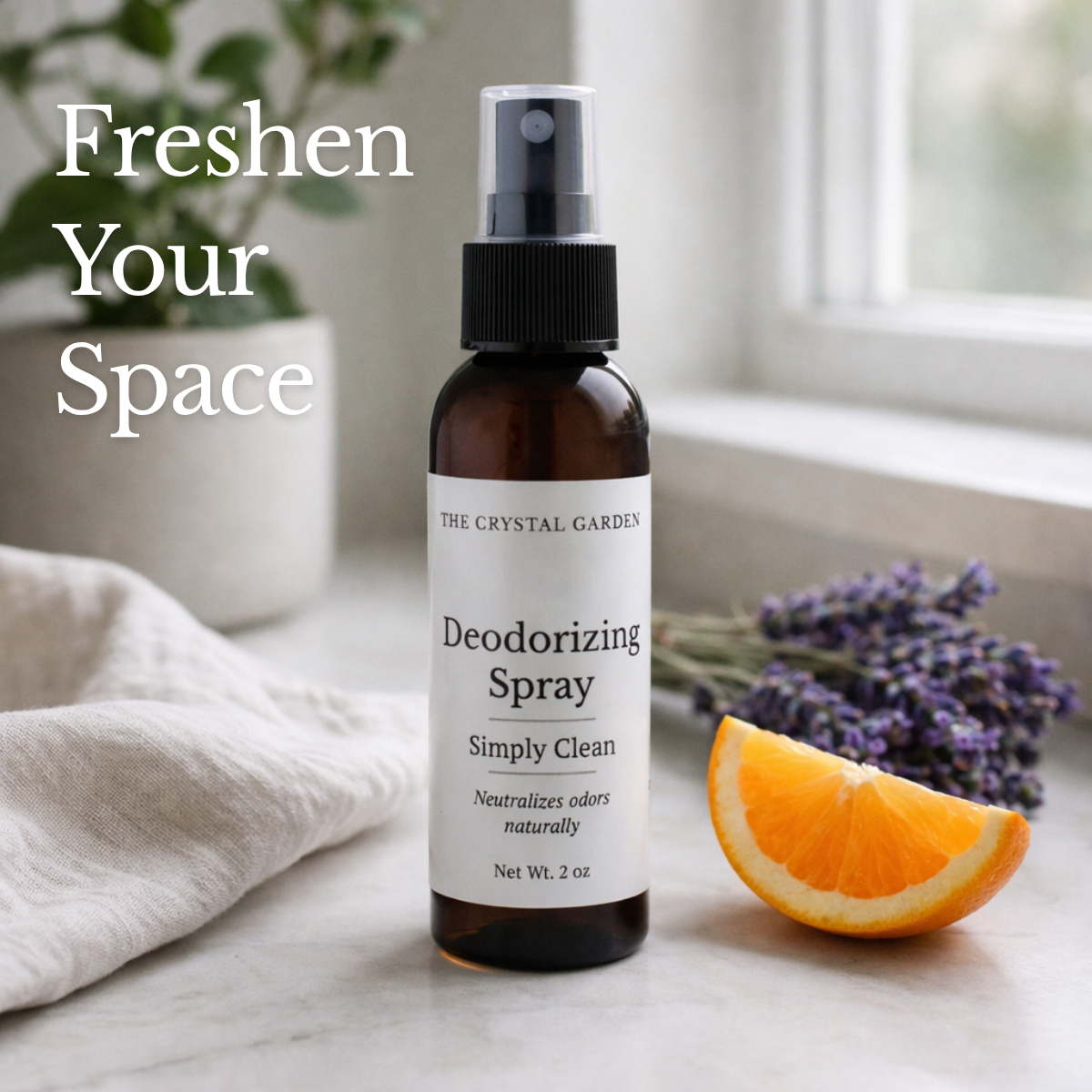Simply Clean deodorizing spray styled on a clean countertop with lavender and orange for a light, plant-based home fragrance.