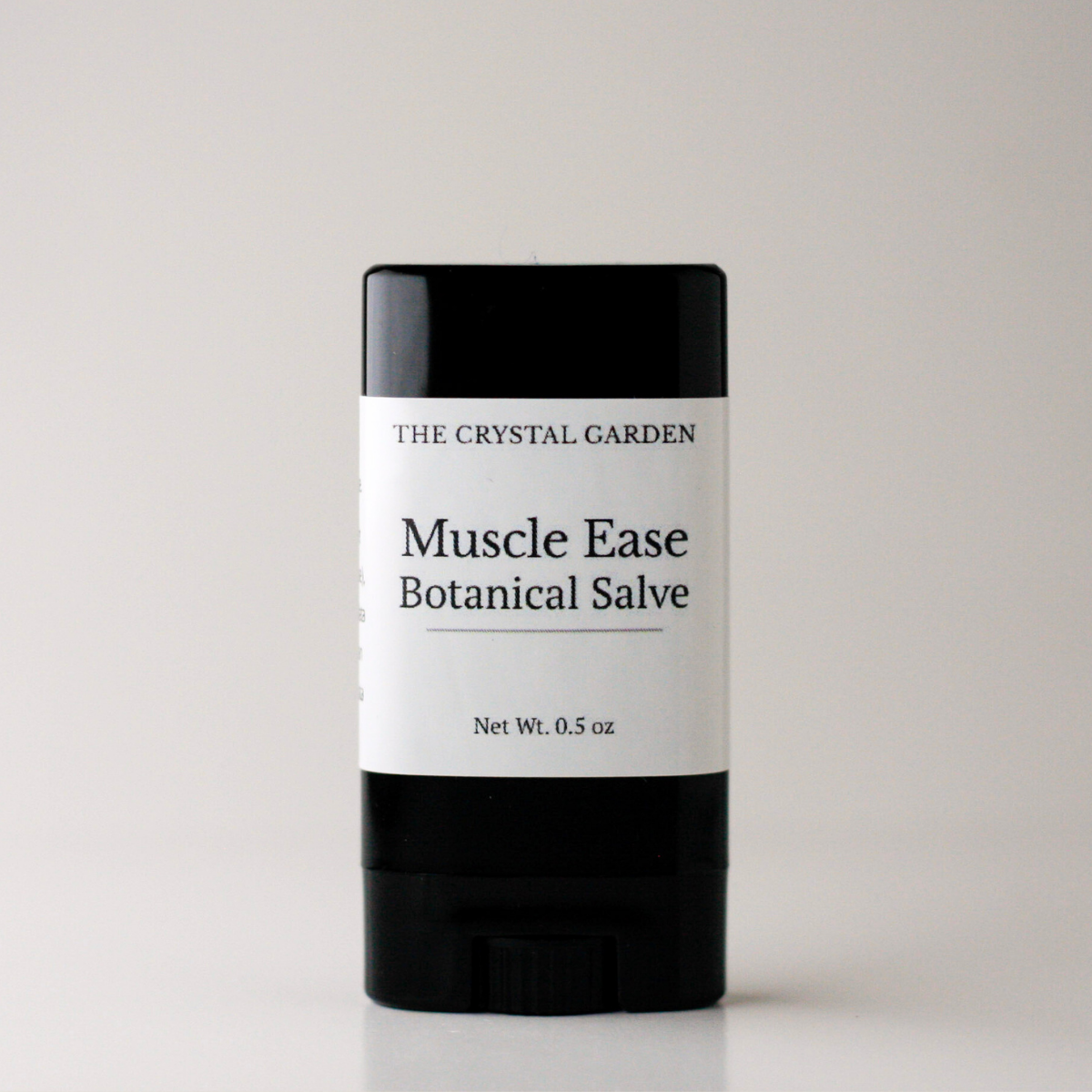 Muscle Ease botanical salve in black twist-up tube for targeted plant-based muscle care