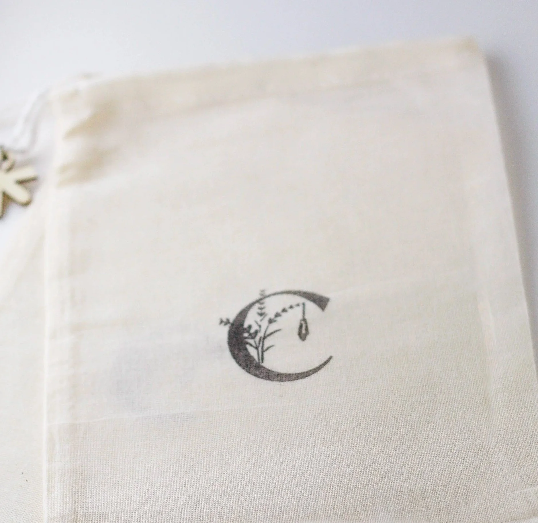 5x7 cotton muslin bag with the Crystal Garden logo stamped