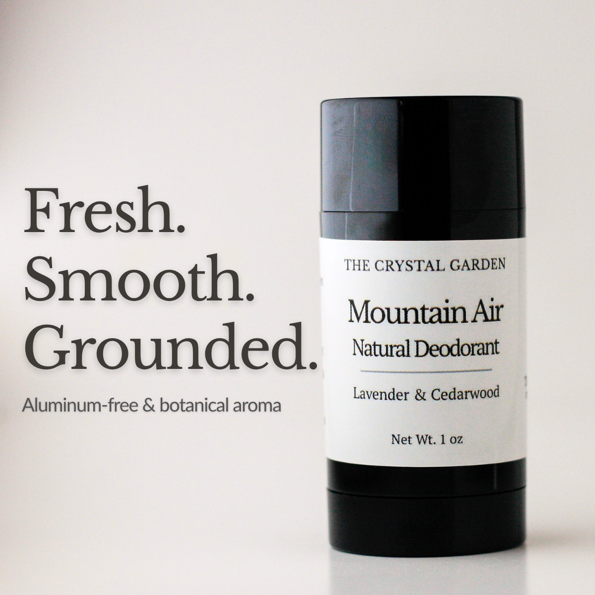 Round black deodorant tube labeld Mountain Air with lavender and cedarwood by The Crystal Garden
