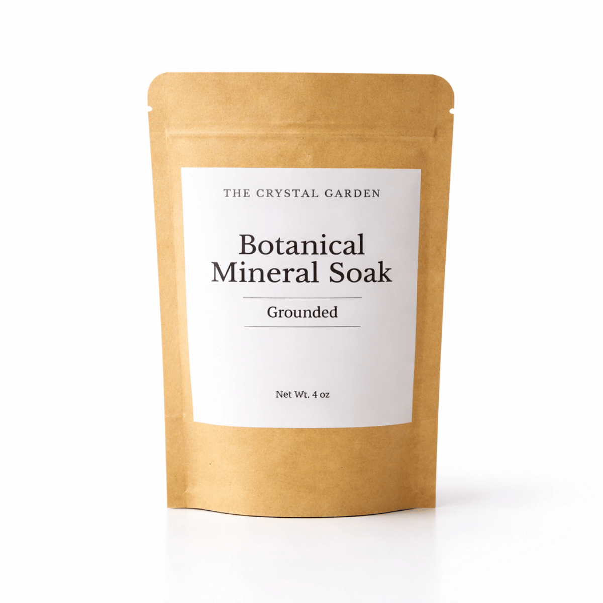 The Crystal Garden Grounded Botanical Mineral Soak single-use pouch styled in a calming spa setting.
