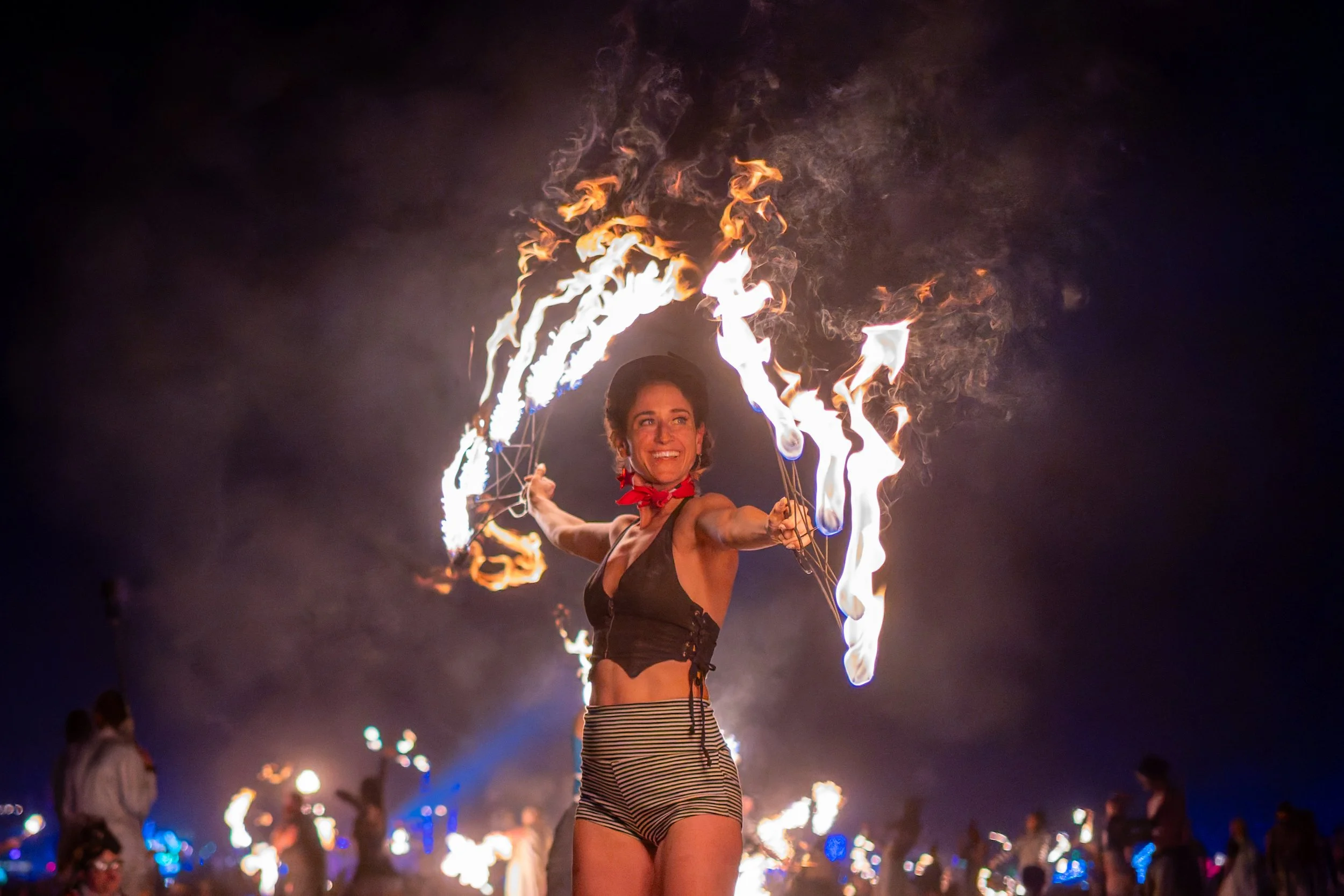 A DJ's hand adjusting controls on a green-lit DJ mixer or turntable.