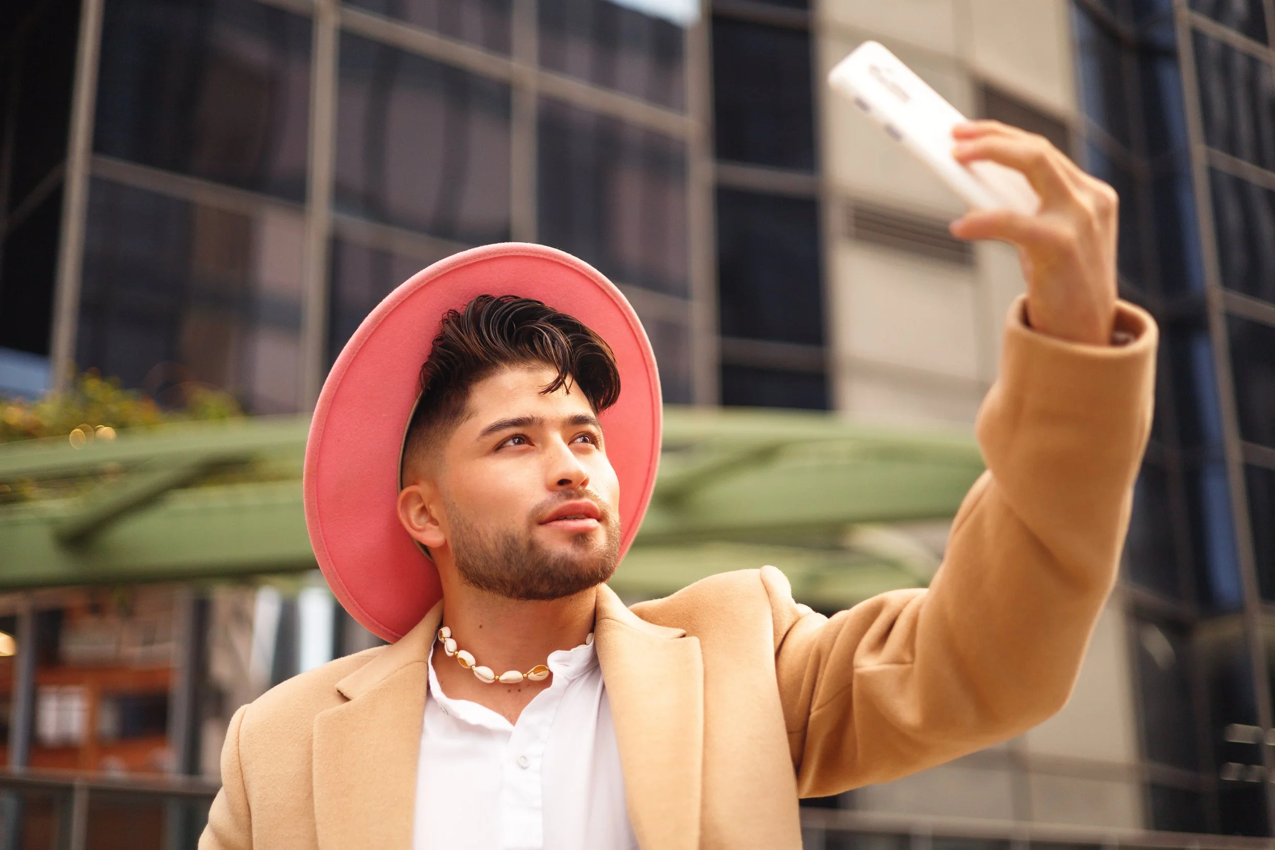 Content creator filming user-generated content on a smartphone for a brand campaign