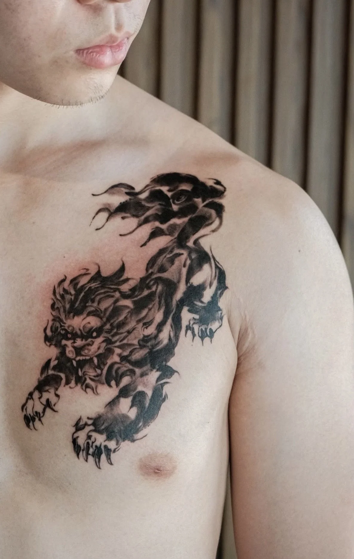 Fiery dog black ink tattoo