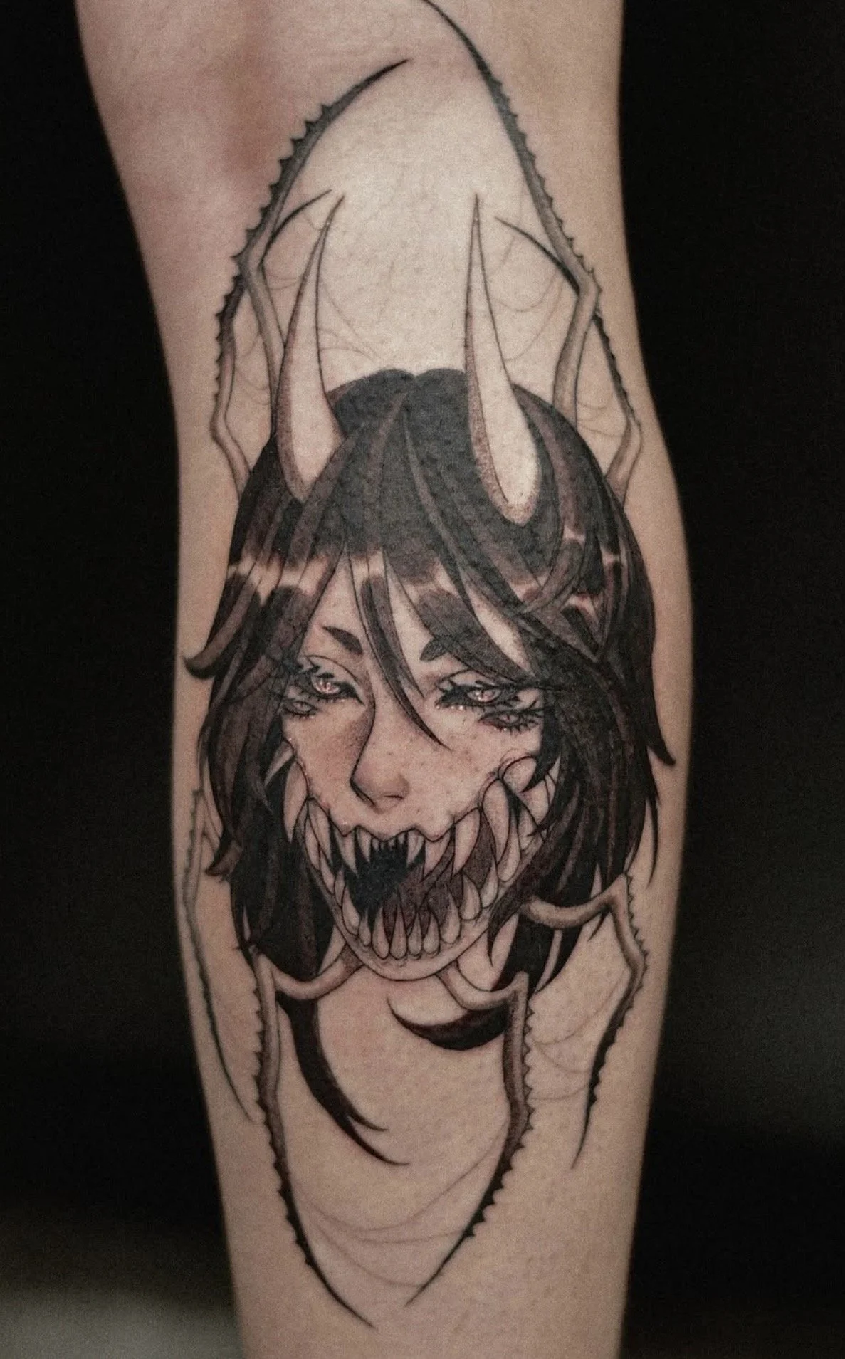 Dark anime girl with teeth and horns and spider legs tattoo