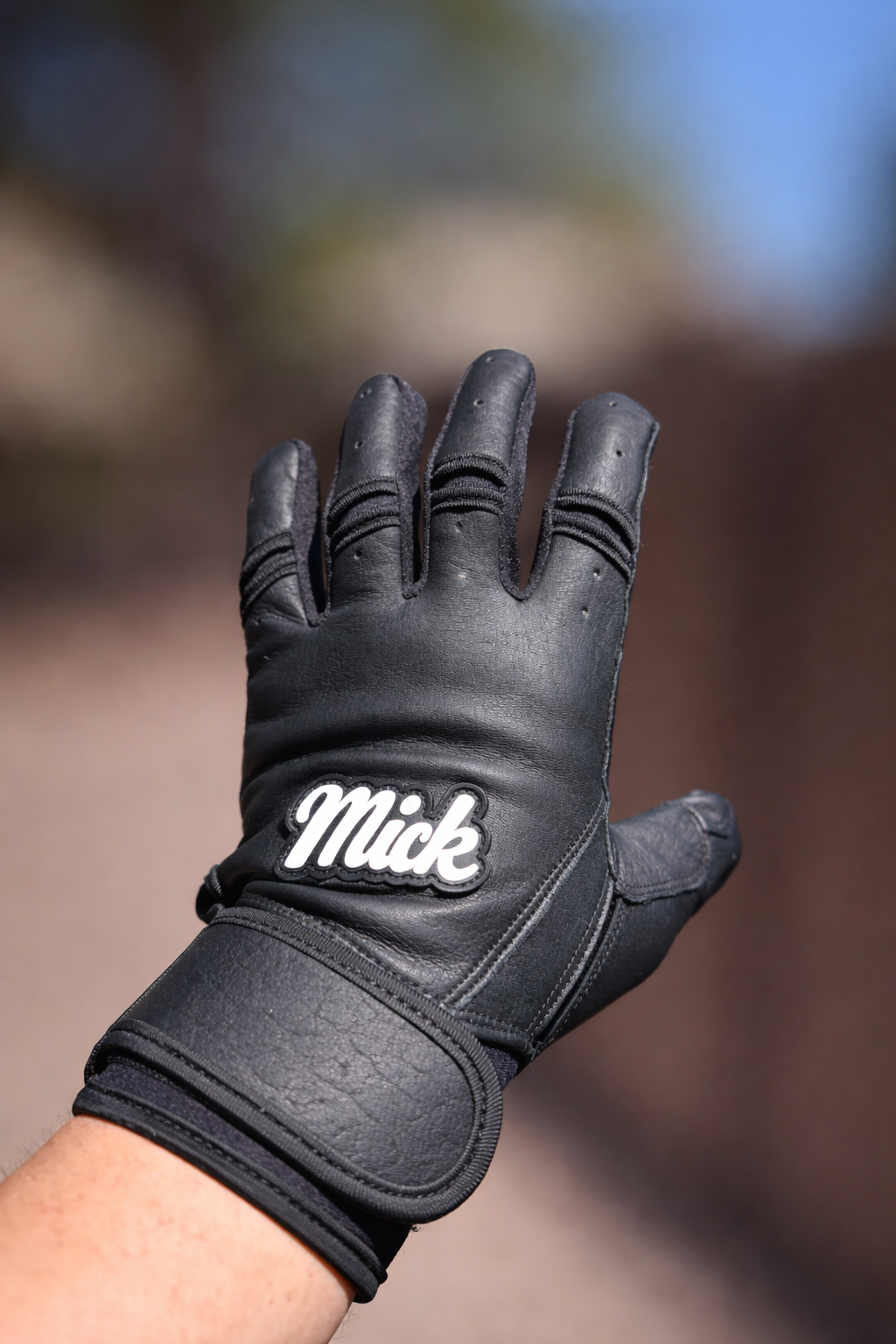 Close-up of black leather batting glove.png