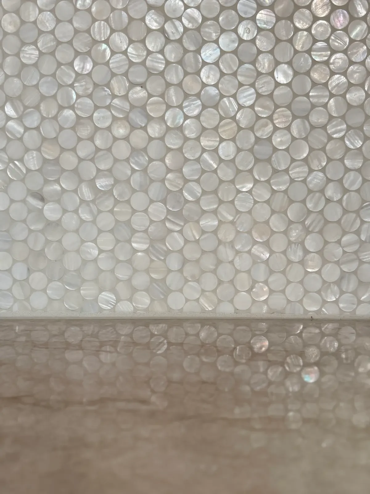 Mother-of-pearl coin tile backsplash and walnut cabinetry in Fjellsangin kitchen, Ashford WA cabin renta
