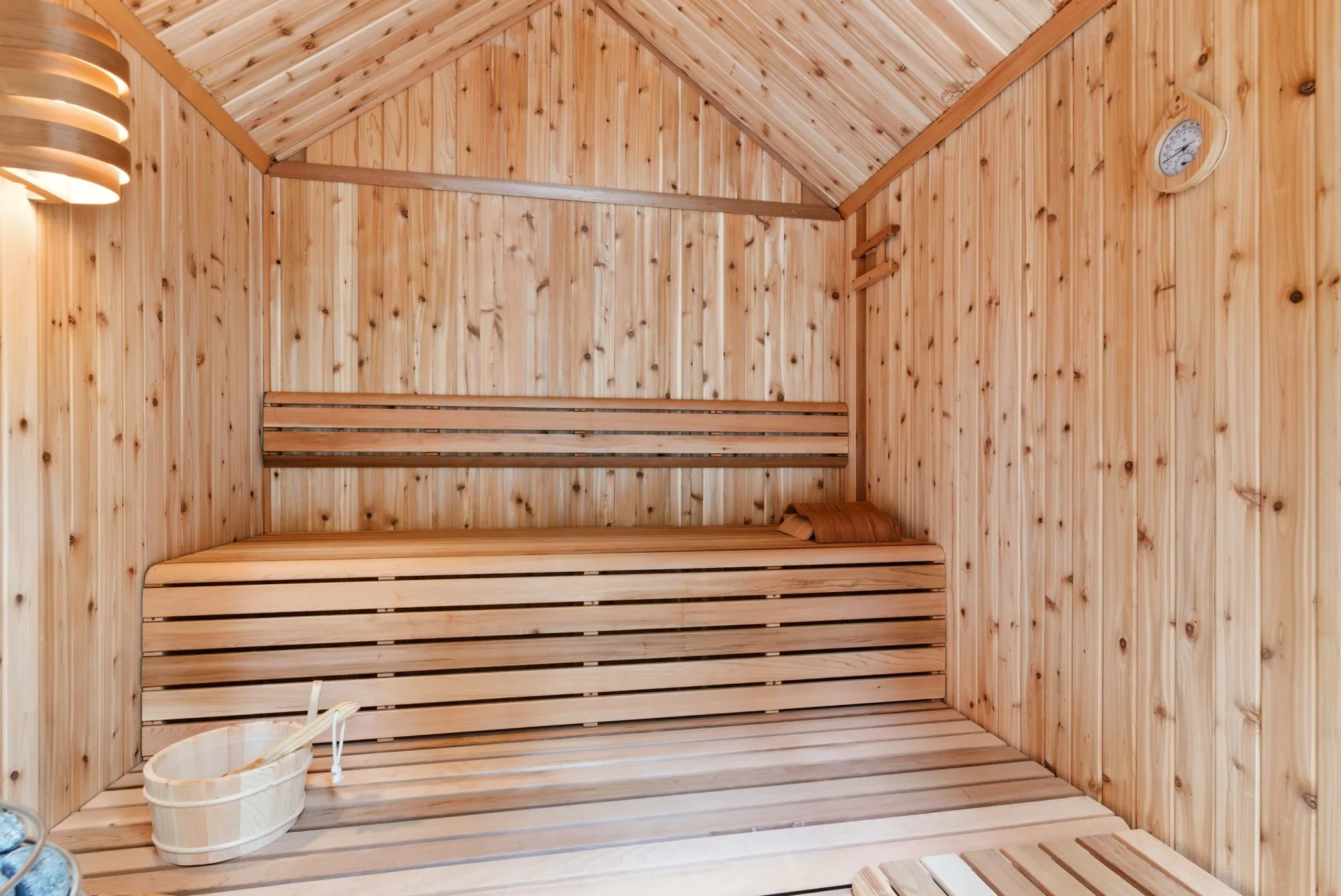 Cedar-lined sauna interior with Harvia heater at Fjellsangin, sauna cabin near Mt. Rainier