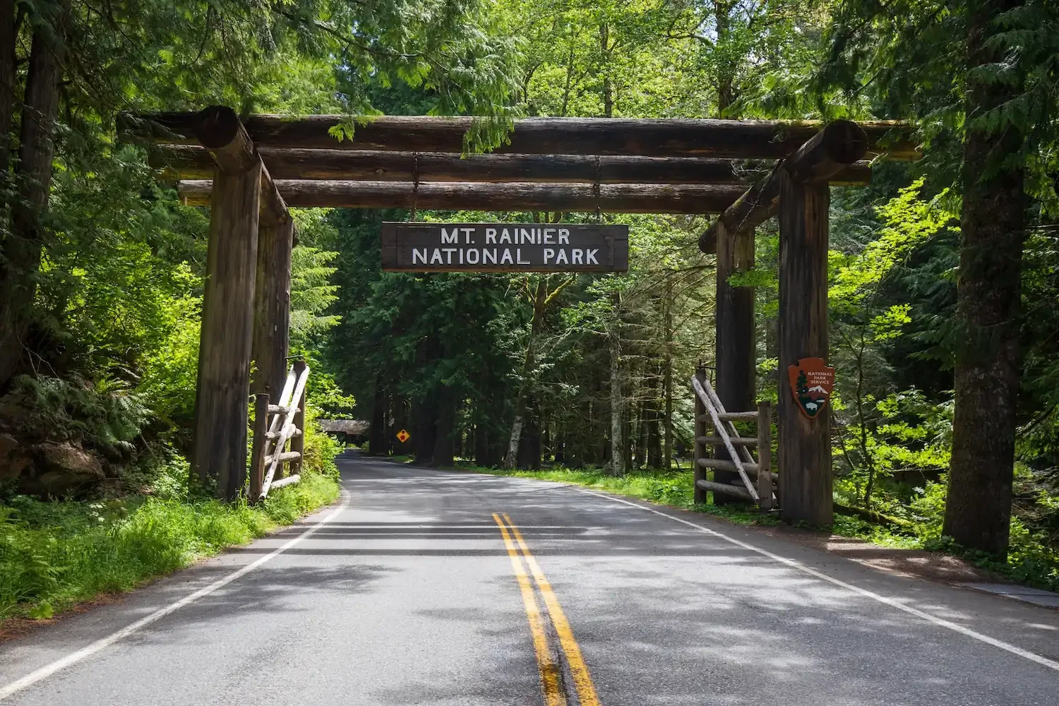 Nisqually Entrance log arch at Mount Rainier National Park — 10 minutes from Fjellsangin luxury cabin in Ashford WA