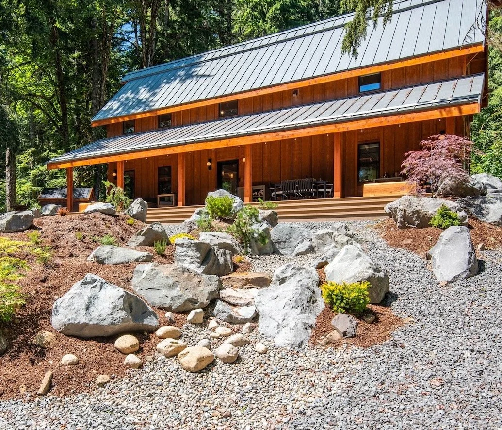 Woodtone cladding and Nordic-Japanese garden plantings at Fjellsangin, forest cabin Ashford Washington
