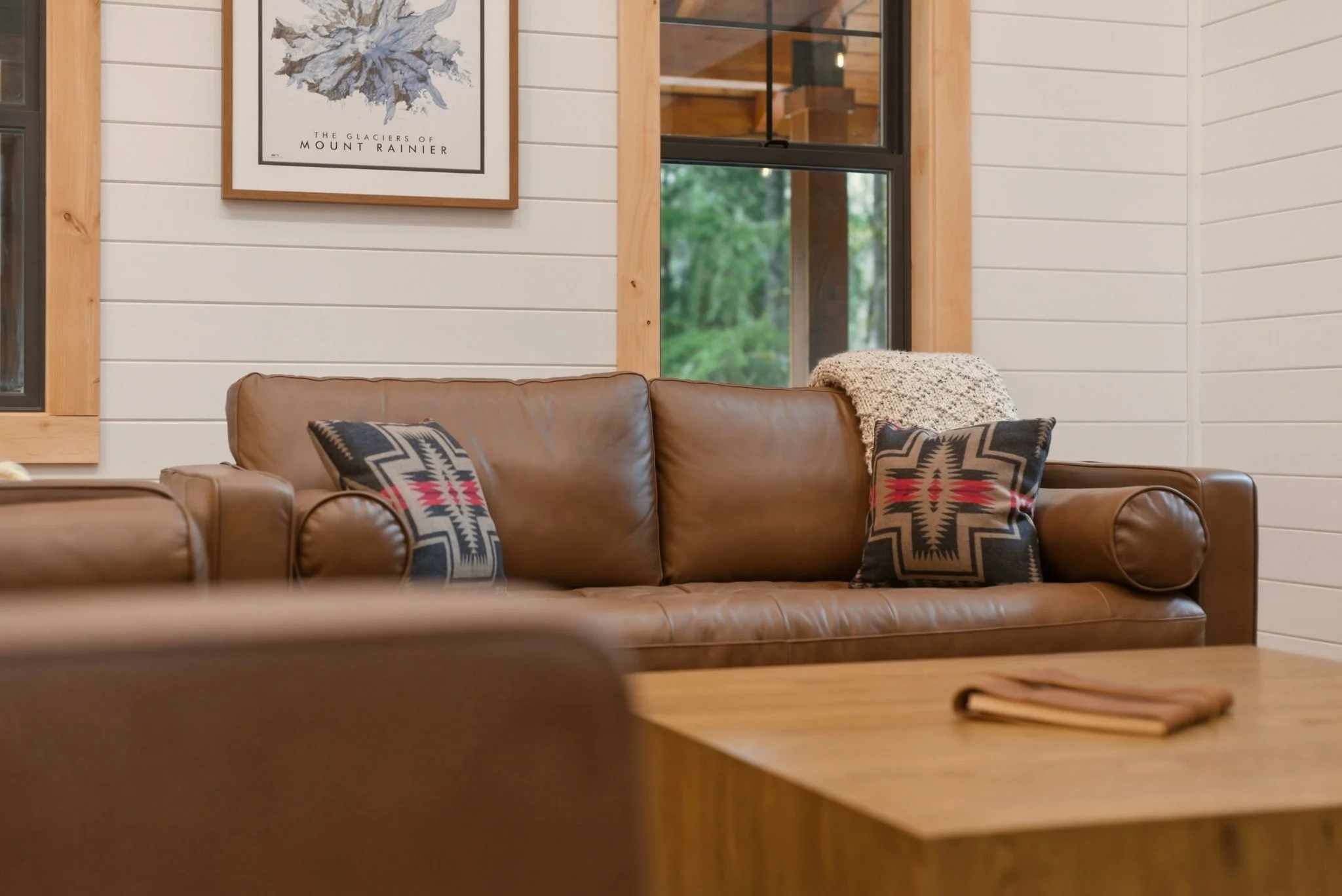 Hand-knit wool throw and hand-sewn Pendleton cushions inside Fjellsangin near Mt. Rainier