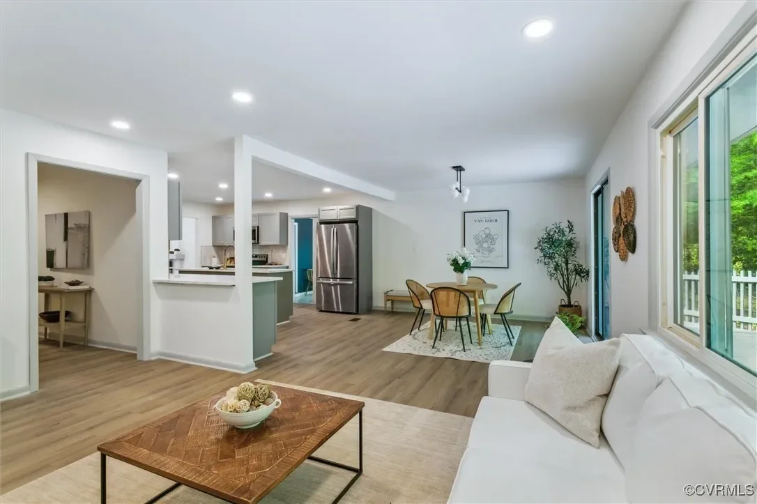 Modern open-concept living and dining area renovation by JDK Strategic Solutions, designed for maximum home resale value and aesthetic appeal.