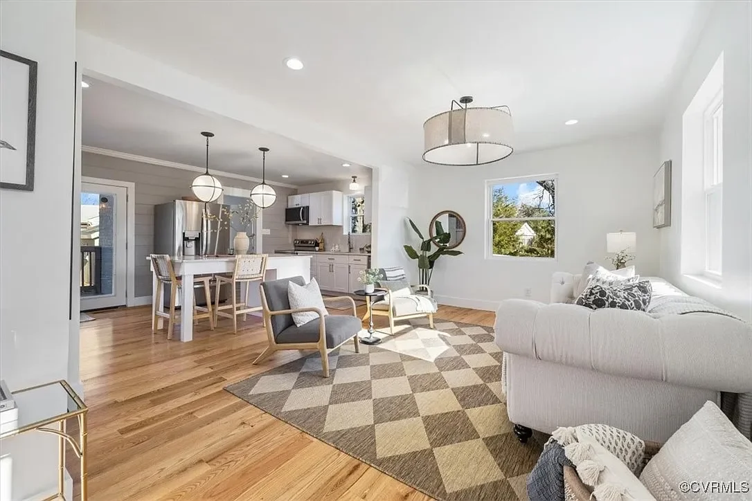 Staged open-concept living area and kitchen from a JDK Strategic Solutions renovation project, optimized for luxury residential living.