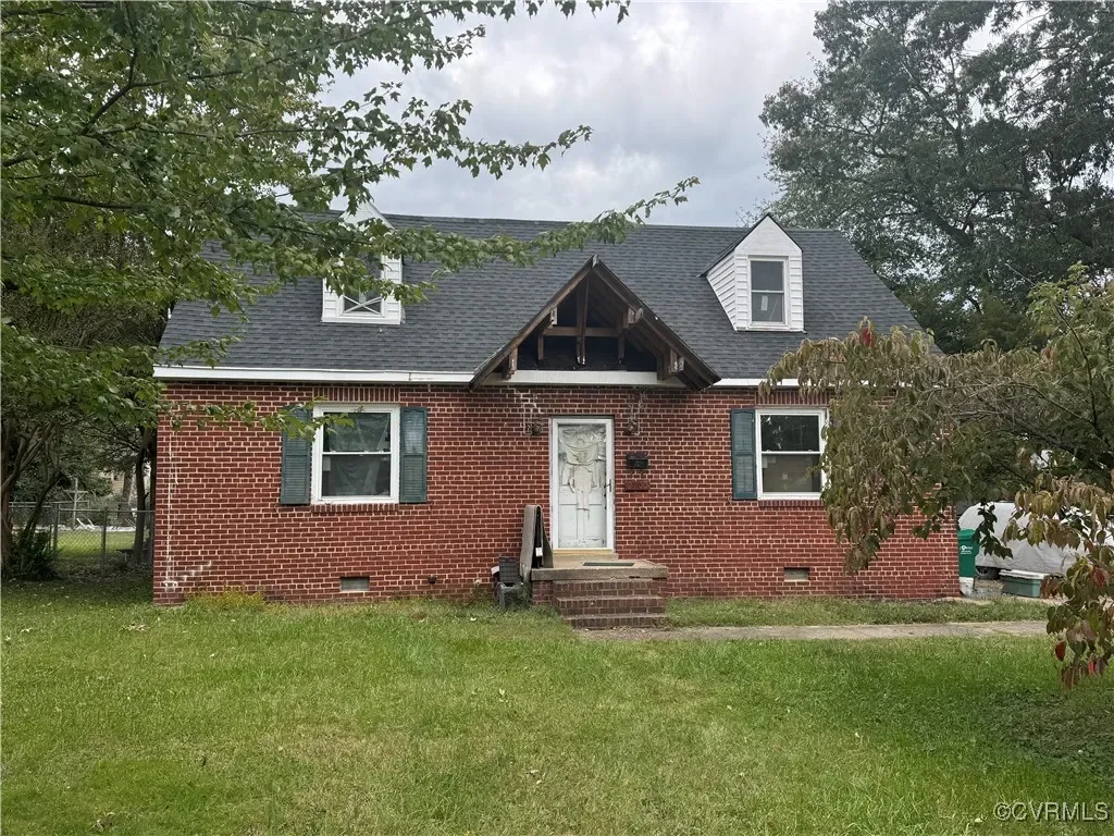 Well-maintained brick investment property acquired by JDK Strategic Solutions, showcasing classic architectural features and high curb appeal.