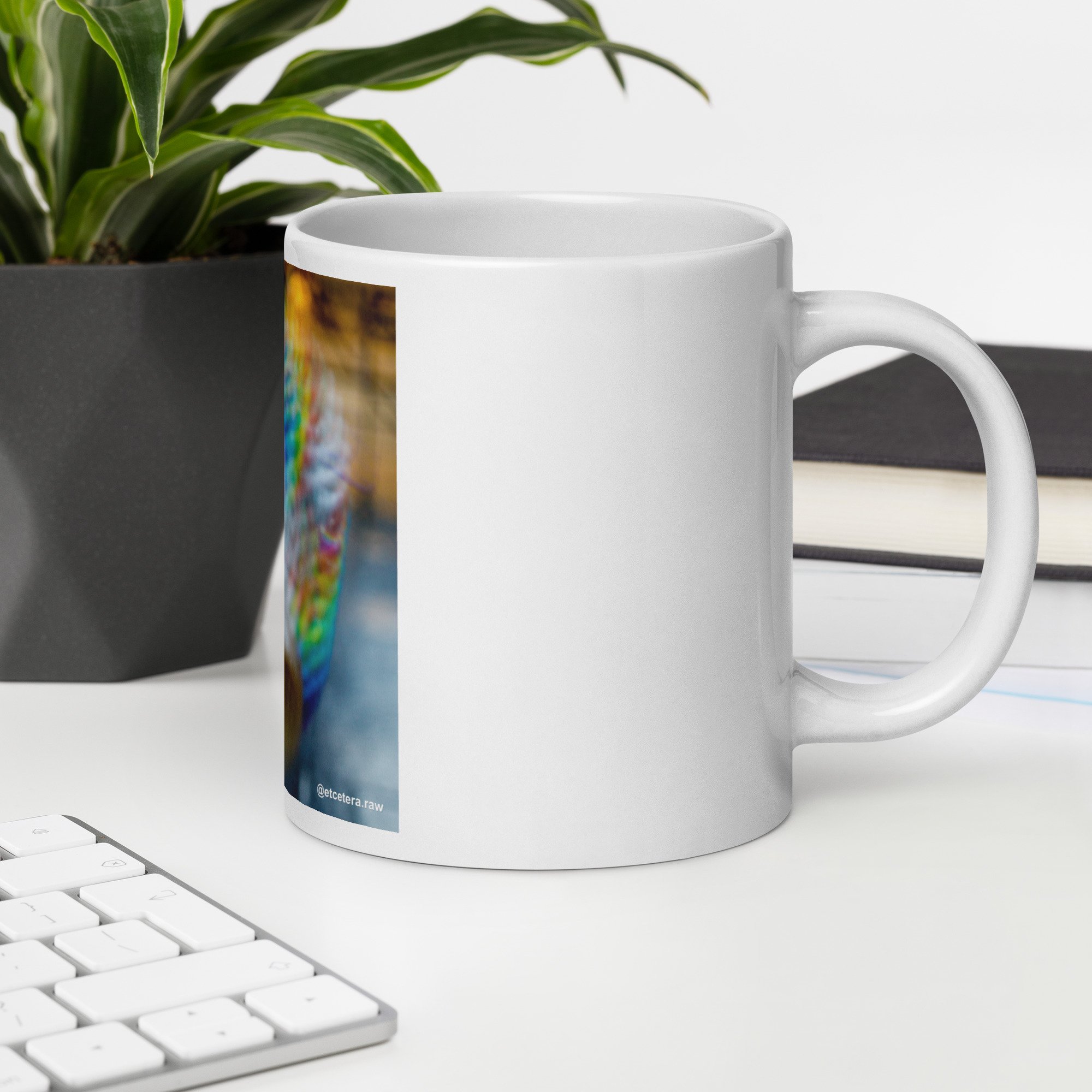 white-glossy-mug-white-20-oz-office-environment-68265a8ddf6f9.jpg