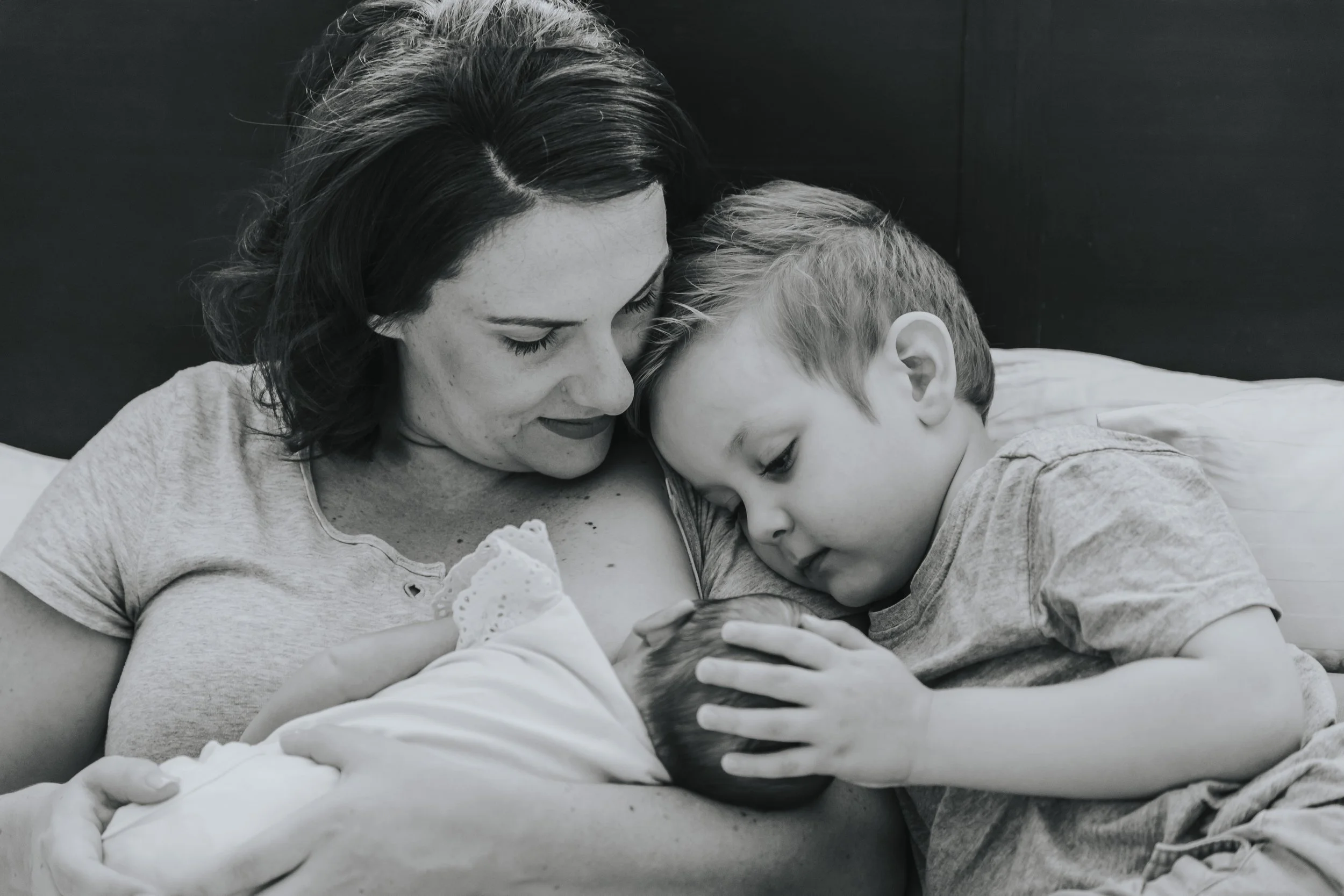 Mother and baby receiving breastfeeding and postnatal support