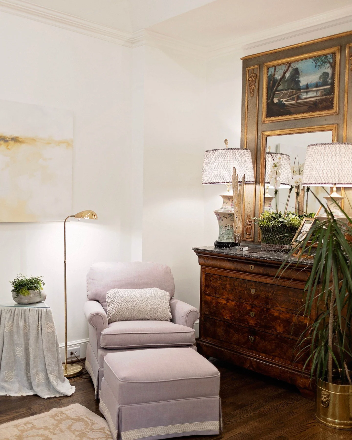 Every home deserves a cozy reading nook.

This corner was transformed into a quiet retreat with layered antiques, vintage lighting, custom details, and a well-loved chair that adds a meaningful touch of family history. A simple space to slow down, re