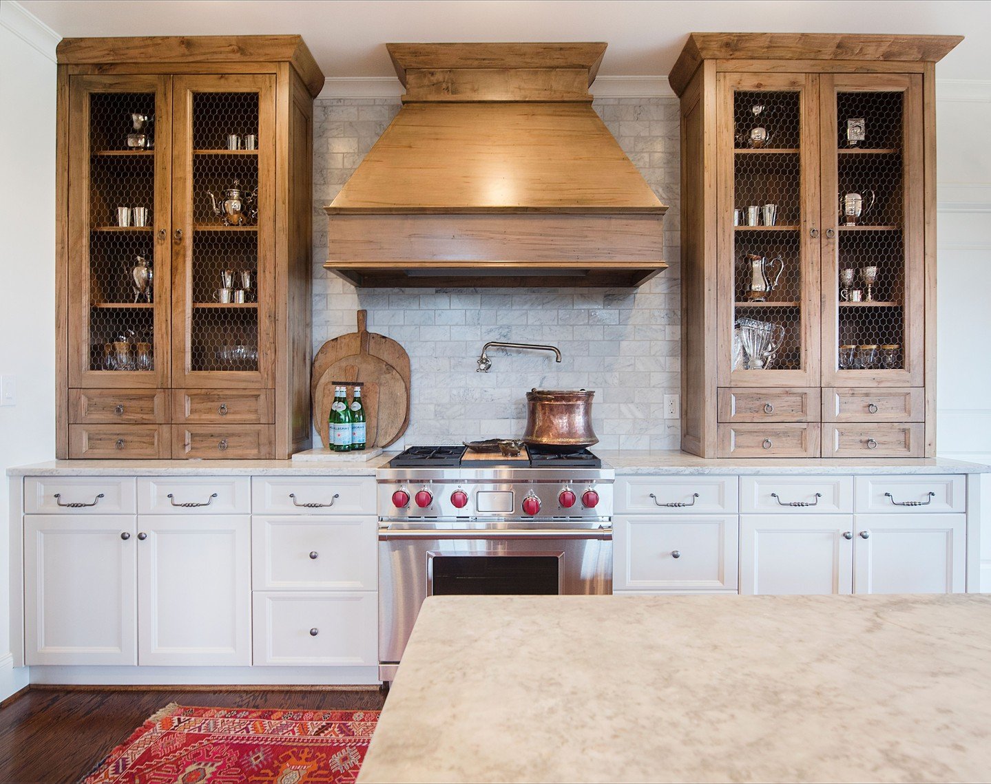 Mixing old and new is the name of the game here. Though this kitchen is new construction, we wanted it to feel like it had always been there; one that could hold its own against the prized elk mounted just next door in the living room, and give her f