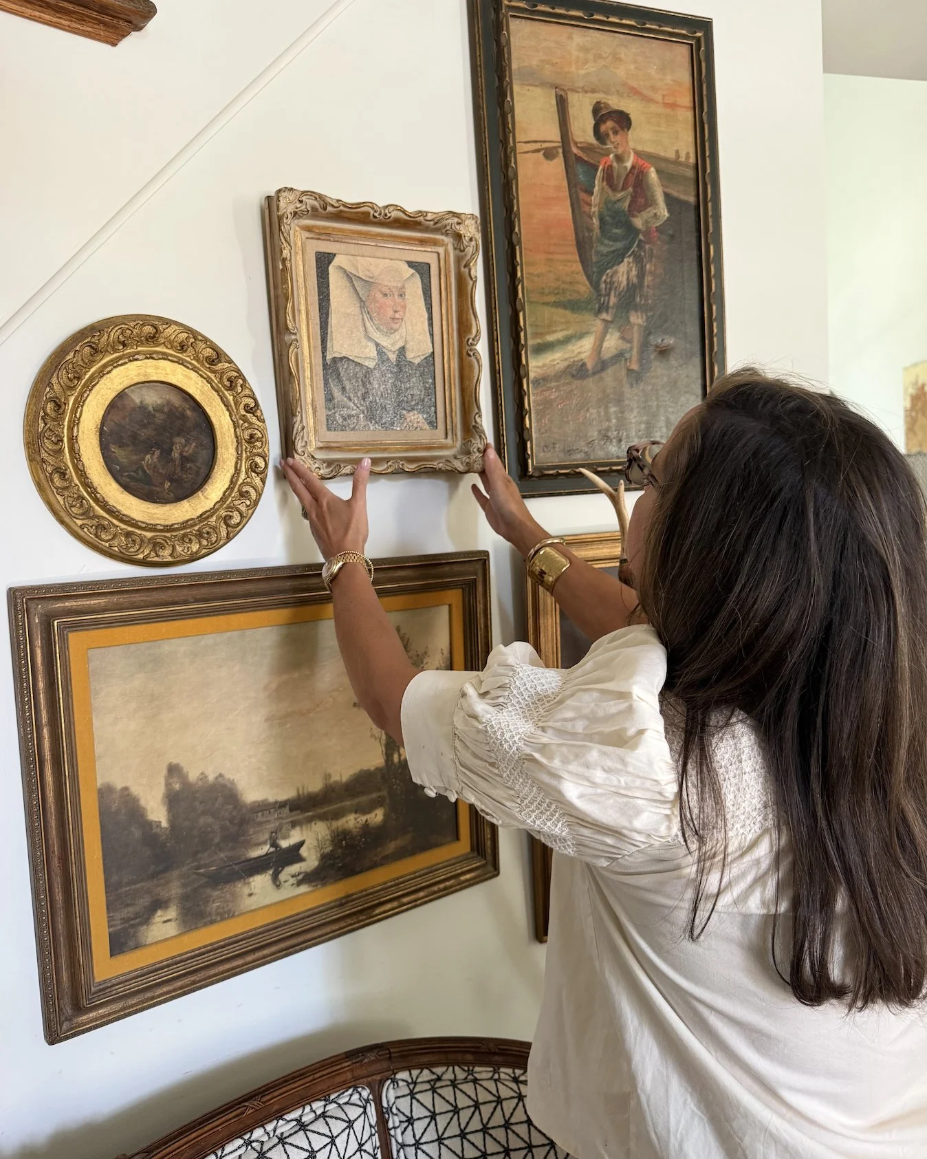The antique gallery wall, and this one's mine. I just took these down off the wall as we get ready to move. (Stay tuned for the how and why behind going from 6,800 square feet down to 1,200!) But this wall? It's definitely coming with me.

Some of my