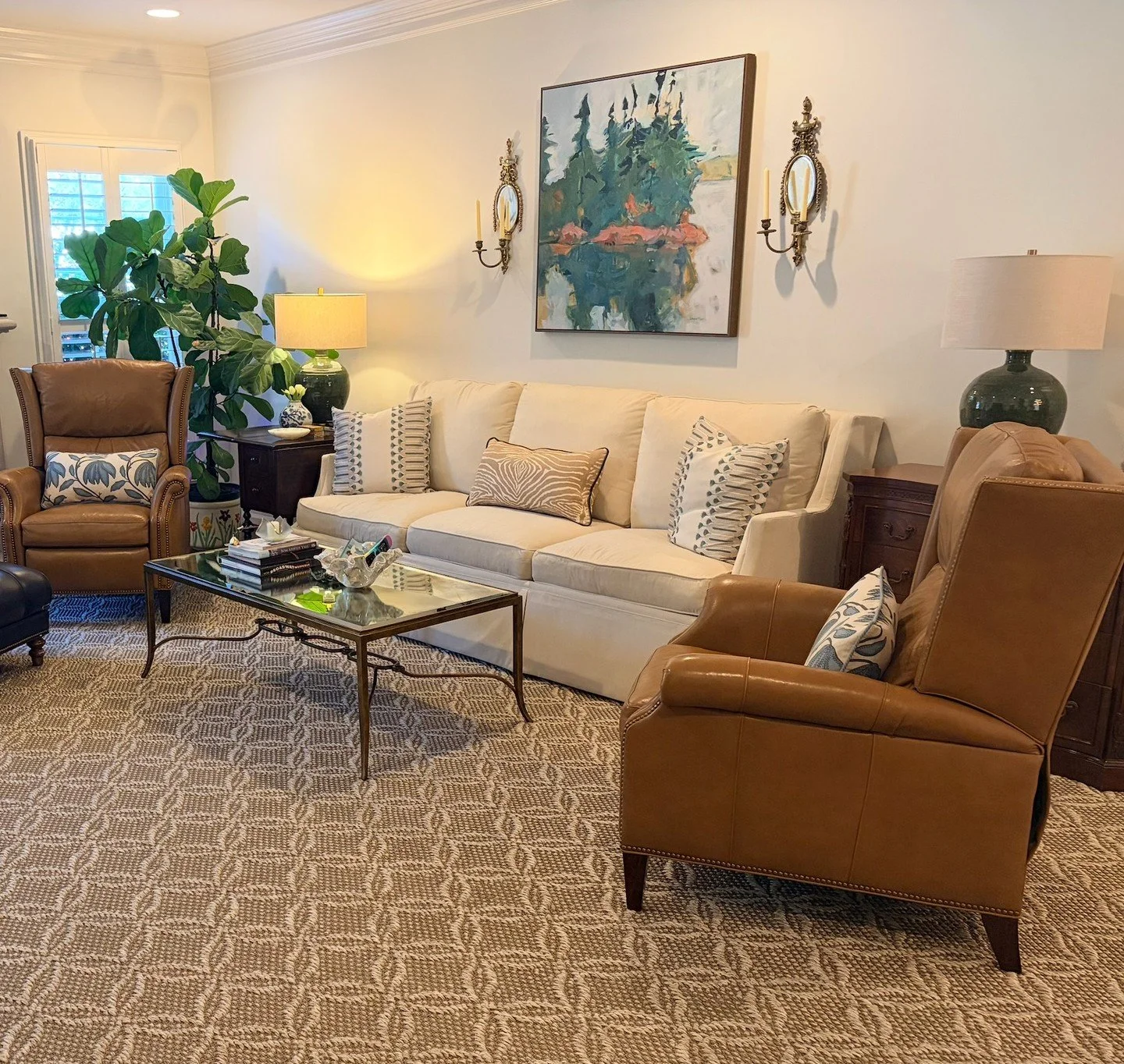 A custom rug fills this space just so and adds the warmth the room needed. Custom pillows pull the art and lamps together, so everything feels like it belongs. 🖼️

And stay tuned, because more custom upholstery is on the way, including a custom-heig