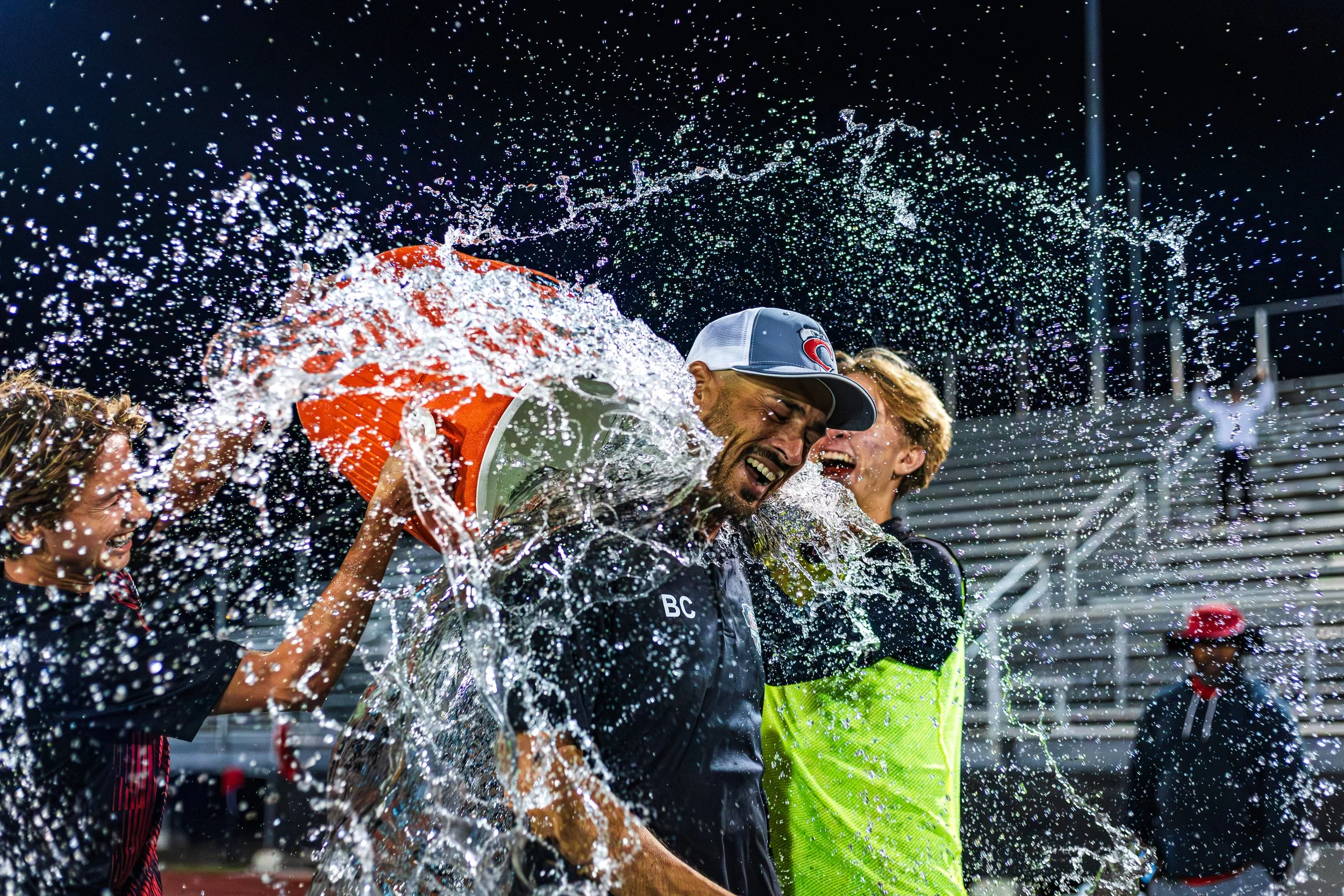 100 Wins - Coach Brandon achieves his 100th Varsity win as he gets drenched in water by his players.