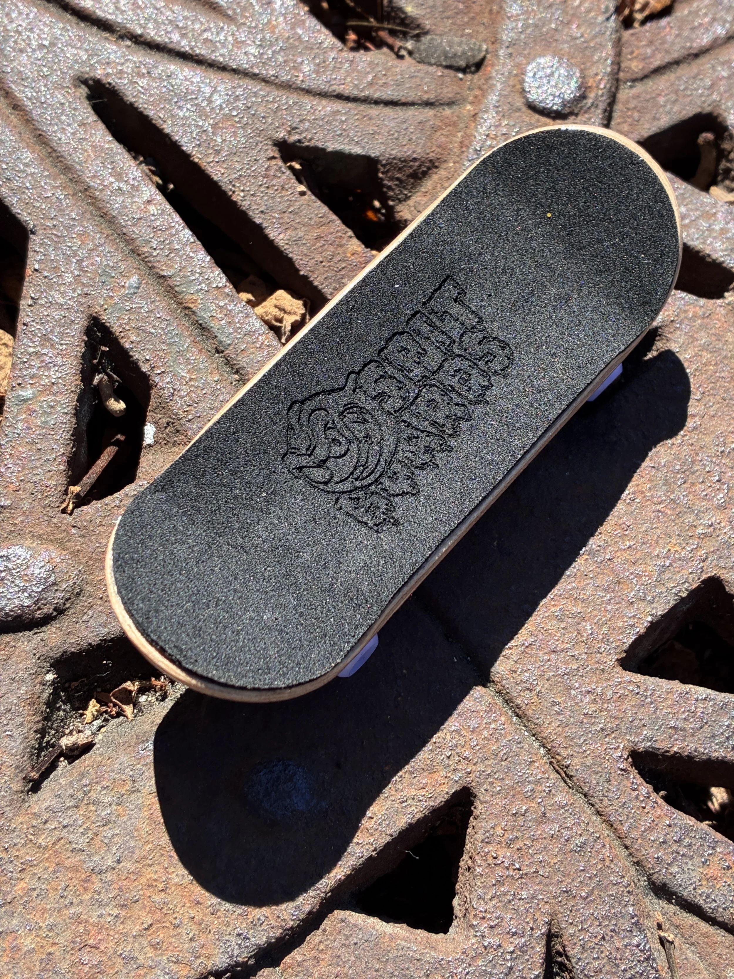 Spitboards laser engraved Griptape.JPG