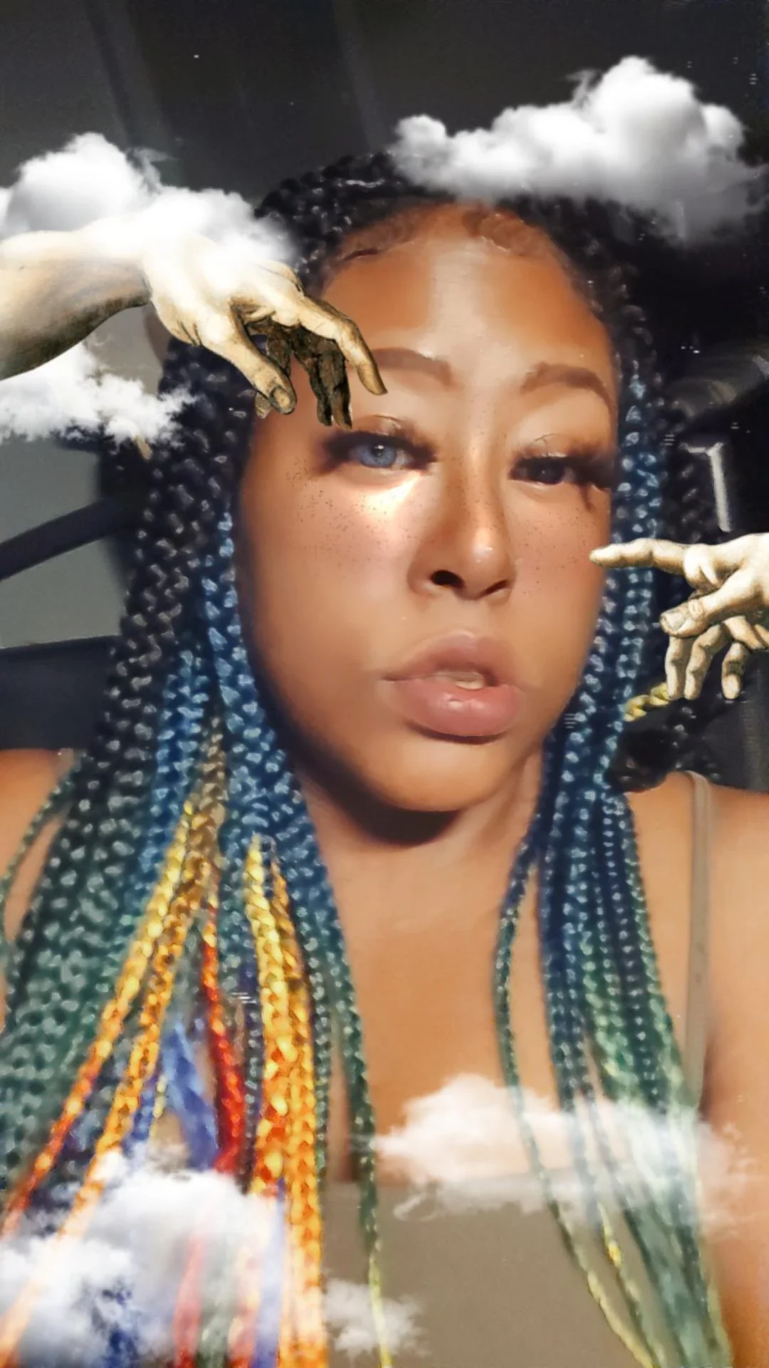 Portrait of a woman with braided hair and freckles, with clouds and a hand pointing at her face superimposed.