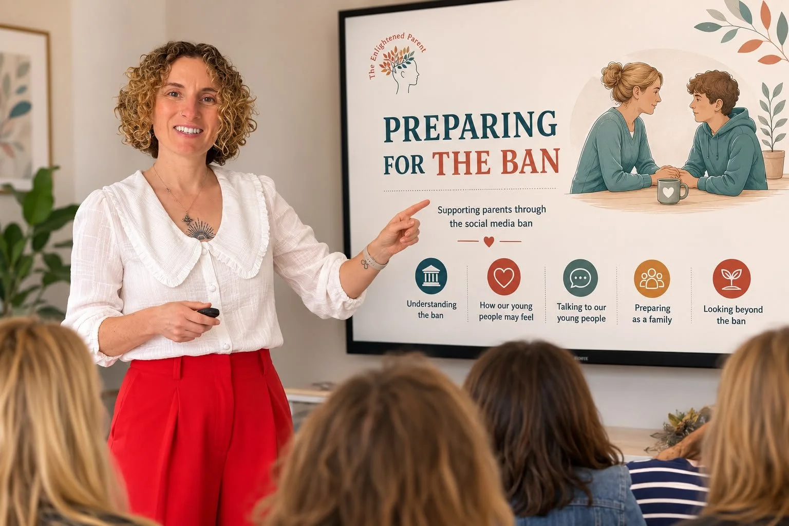 A woman presenting in front of a whiteboard