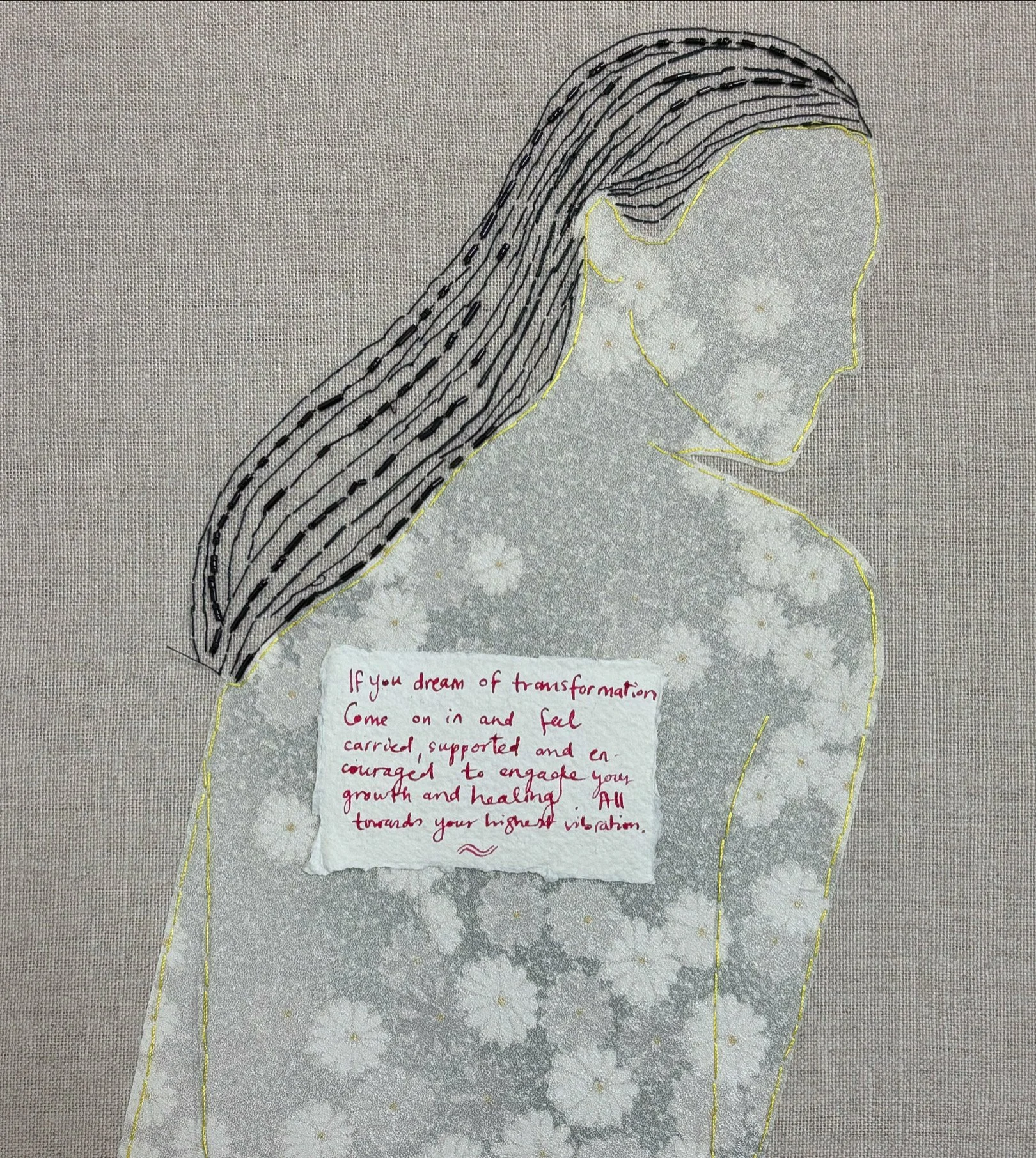 Artistic illustration of a person with dark, wavy striped hair, outlined in stitch-like lines on floral fabric, with a handwritten message about transformation and growth on the back.