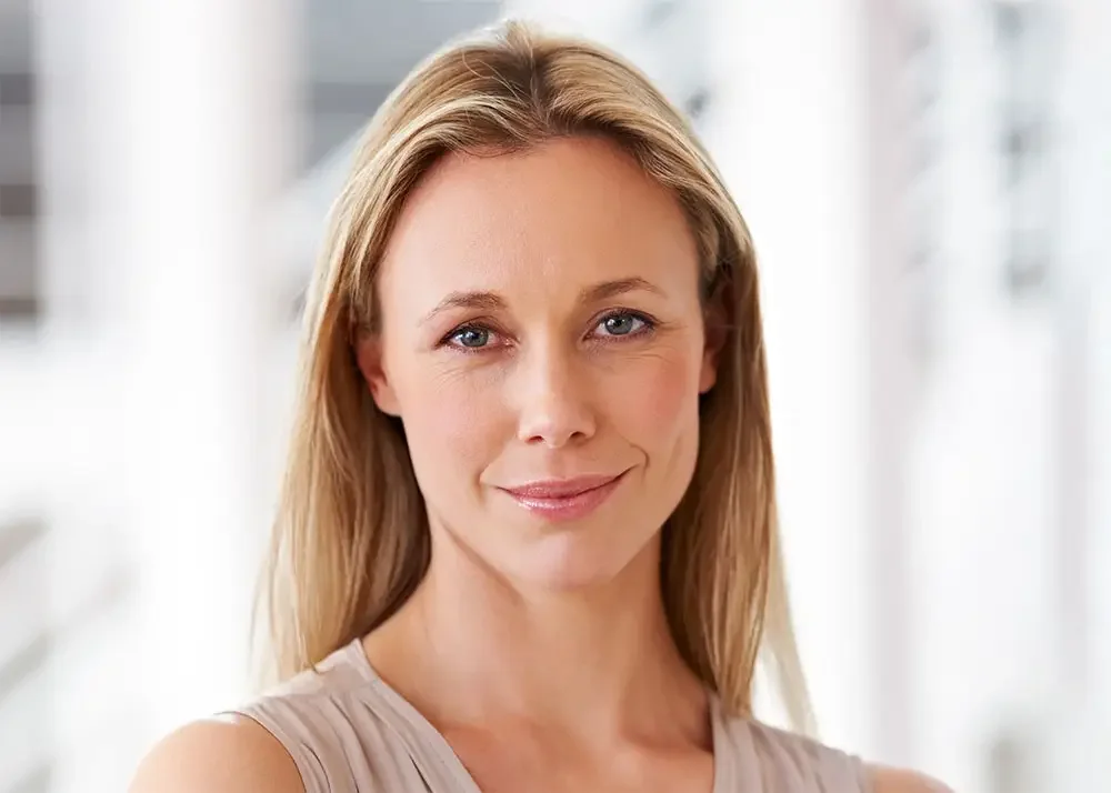 Woman with smooth facial contours and defined jawline after facial rejuvenation
