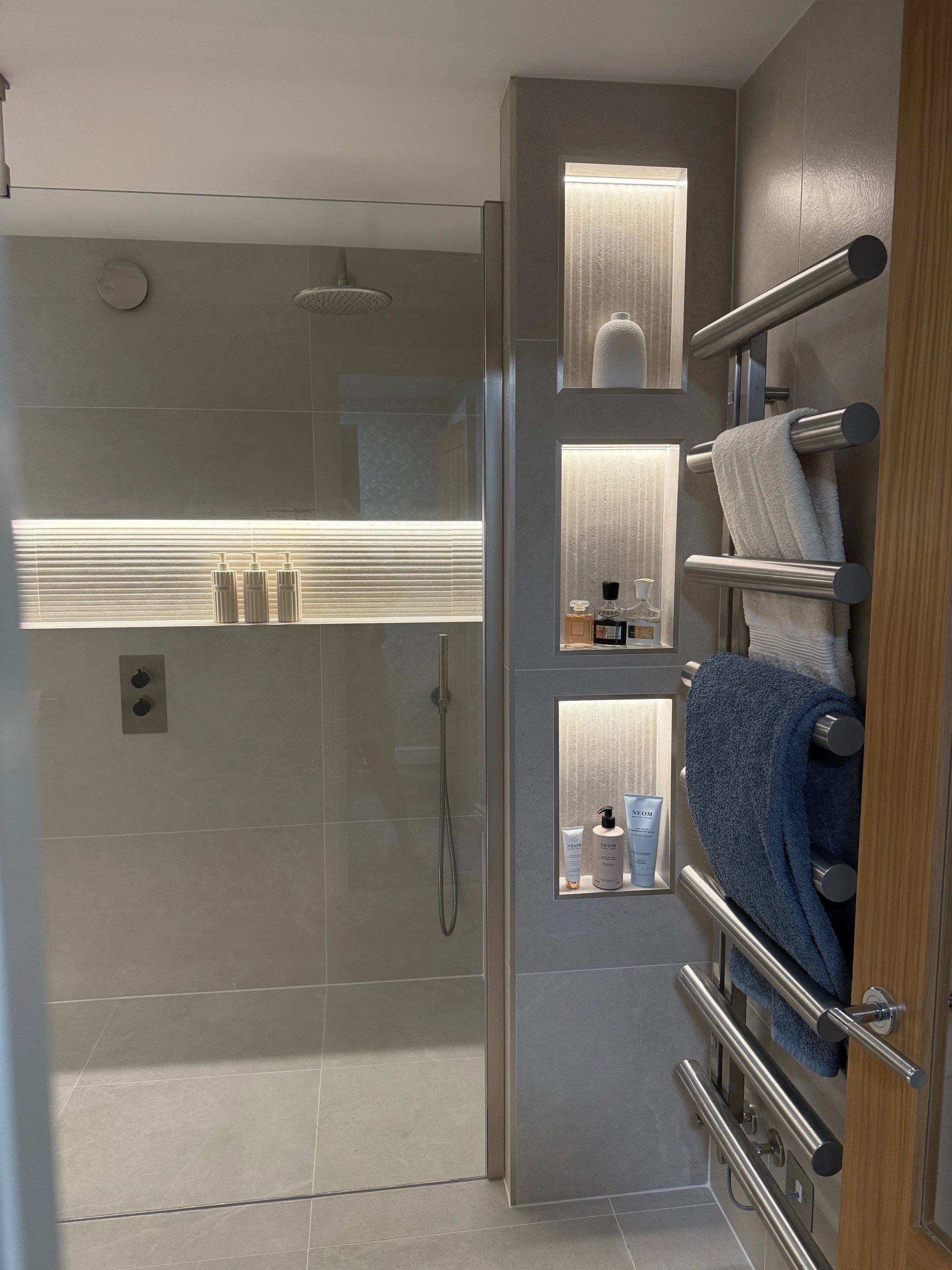 They have this beautiful trio of niches which add handy storage, hide the edge of the shower seat, and are a great option for adding styled details...