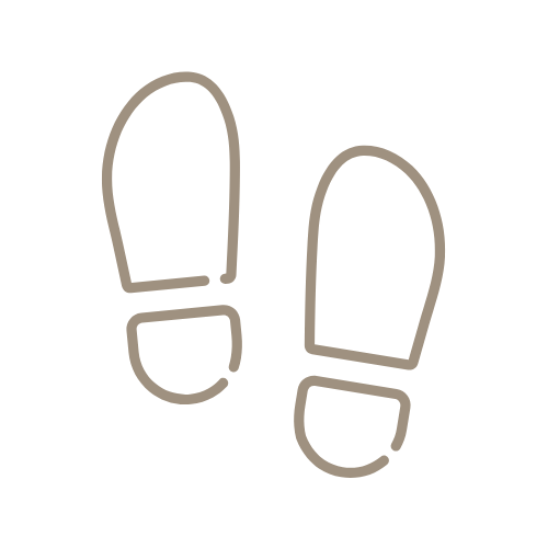 Icon of two shoeprints on a black background.