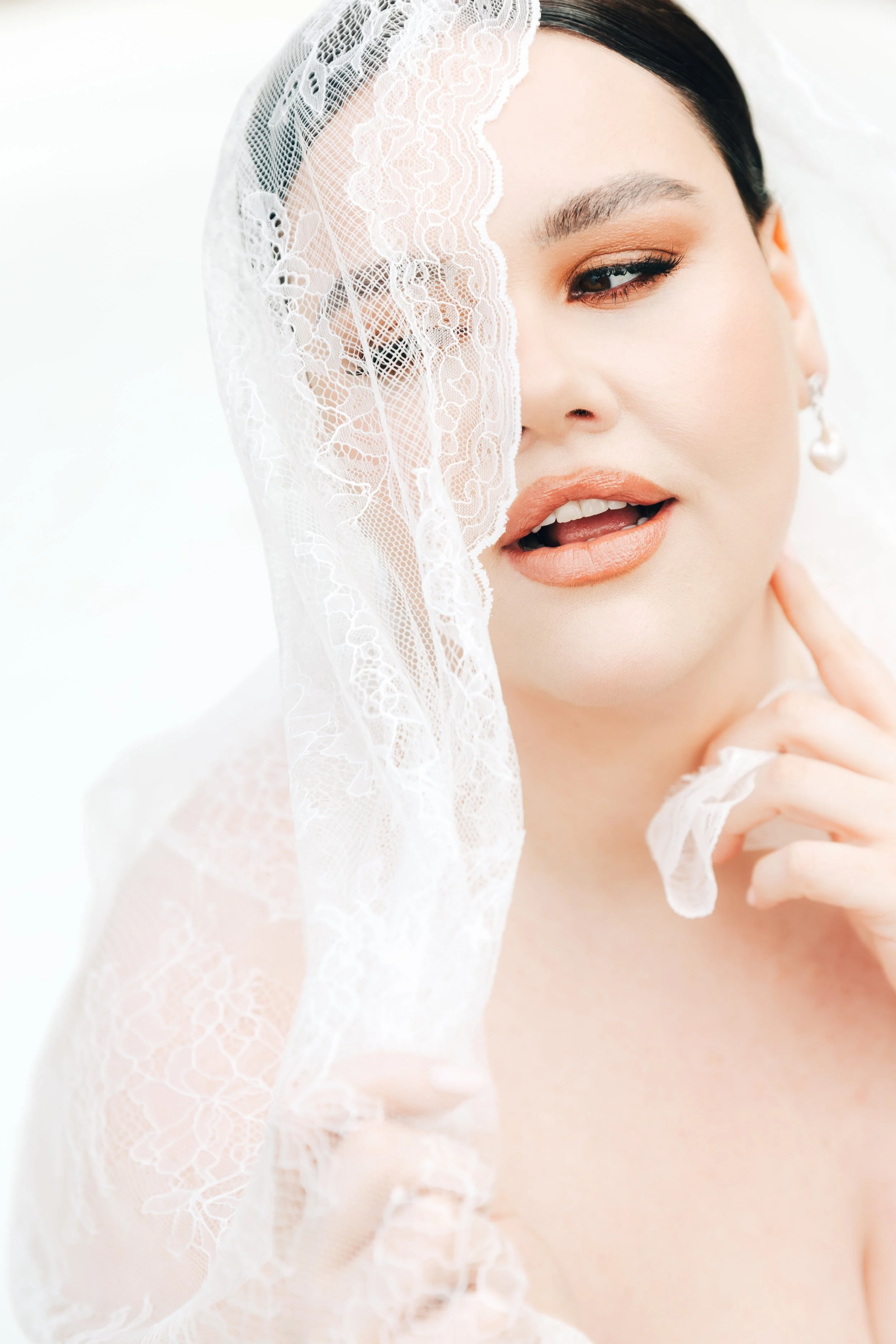 Bridal bright minimalist portrait in mantilla lace veil